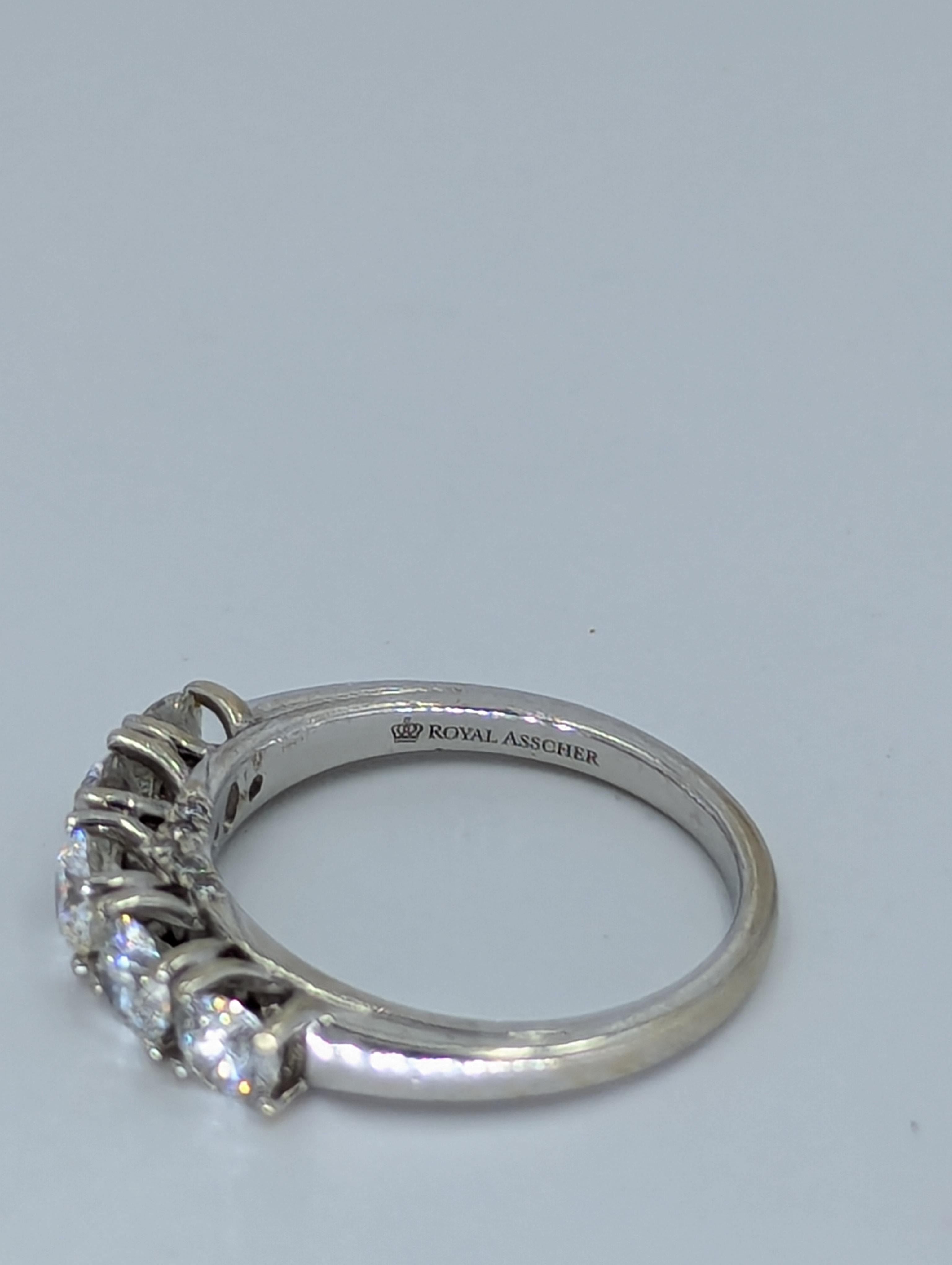ROYAL ASSCHER 1.00ct Diamond 14K Gold Engagement Band Ring 3.7 Grams.
 	
Diamond: 1.00Ctw

Size 6

Diamond Color : Near colorless

Diamond Clarity : VS2-SI

Weight: 3.7g 14KT

Designer: Royal Asscher

Very Brilliant Piece of Jewelry. Ideal for