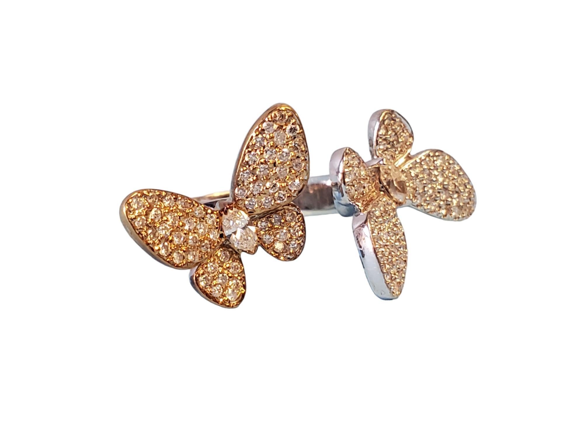 Listed is an estate 18k butterfly ring. This is a designer ring stamped 750, with white GH VS diamonds throughout the design. Its an open ring at the top of the band, size is 6.75. Length is 1.5