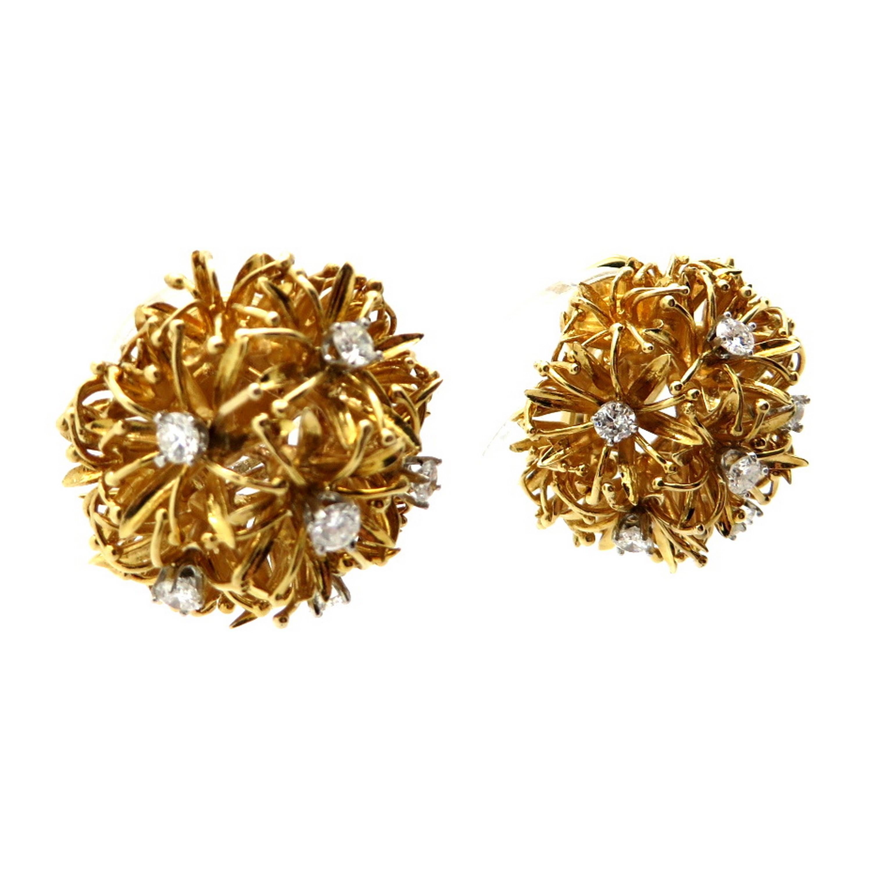 Estate designer David Webb 18K and platinum dandelion diamond earrings. Showcasing 12 round brilliant cut prong set diamonds weighing a combined total of approximately 1.30 carats. Diamond grading: color grade: F. Clarity grade: VS1. The earrings