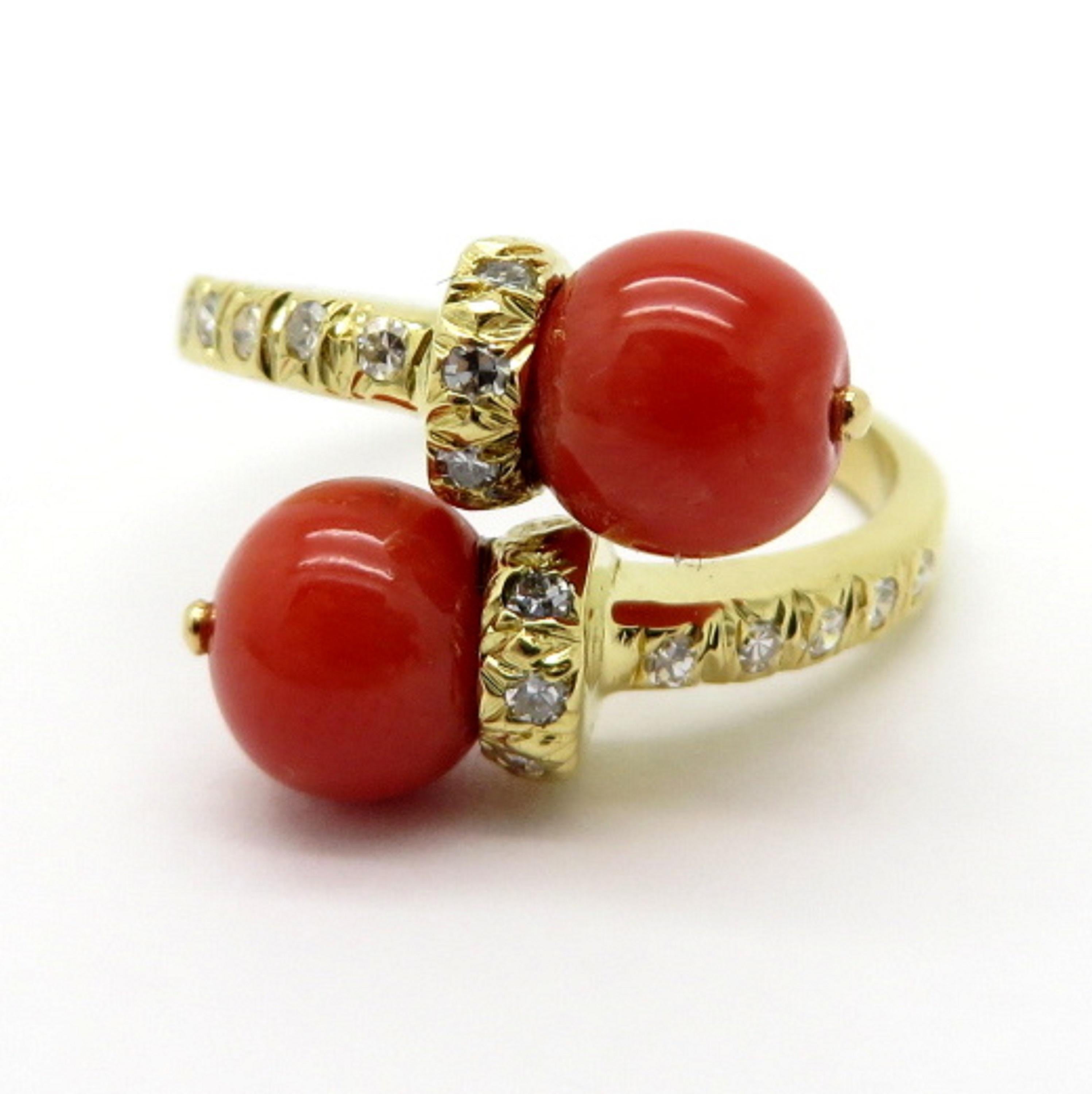 For sale is a beautiful Estate Designer Tiffany & Co 18K Yellow Gold Coral & Diamond Bypass Ring!
Showcasing two round coral beads measuring 6.85 – 7.00 mm each.
Accented by 16 Single Cut diamonds weighing a combined total of 0.15