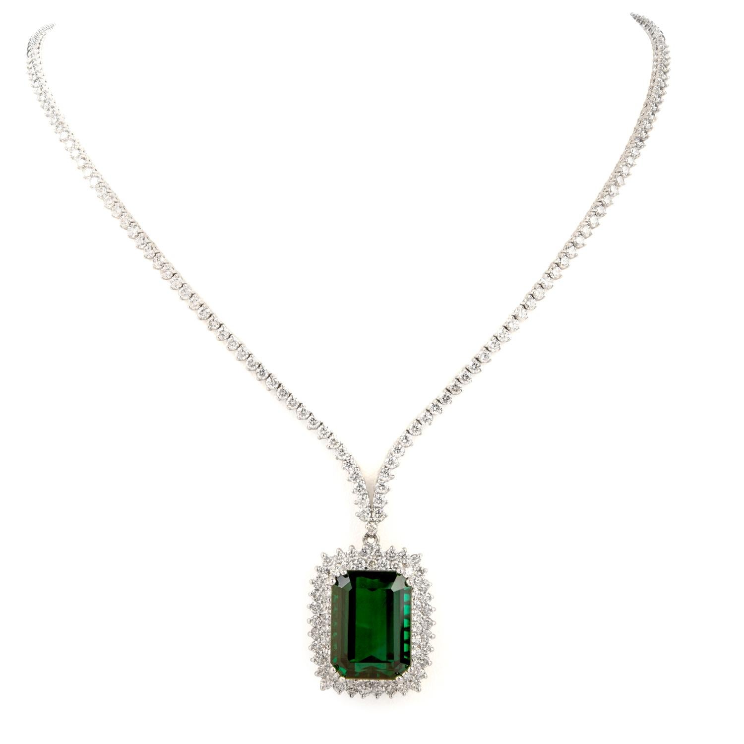 From it's white twinkling Diamonds to the evergreen colored Tourmaline, this Pendant

Necklace is sure to please this holiday season!

As the prominent focal point, this pendant features a large, rectangular  Green Tourmaline

weighing appx. 21.50