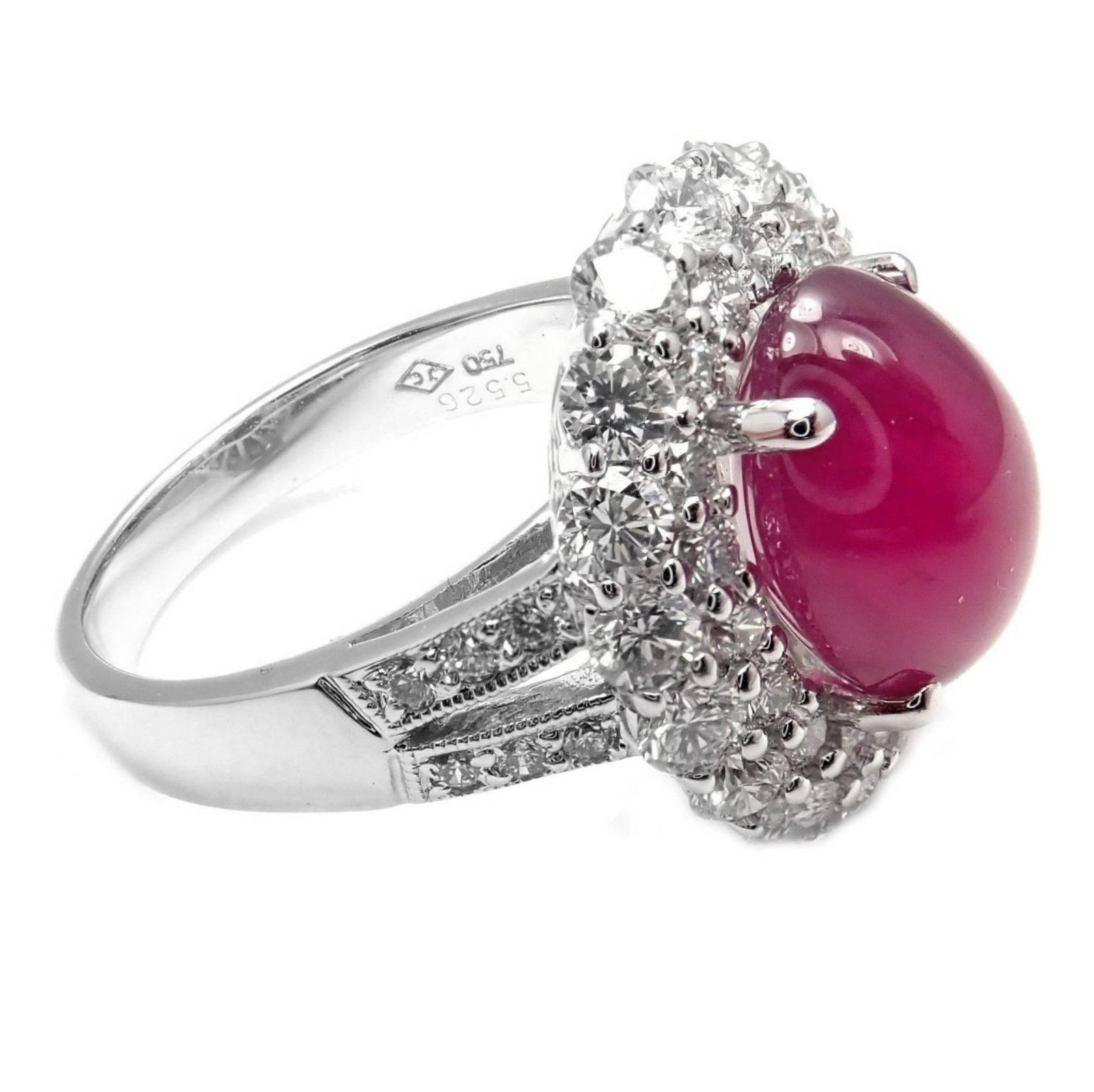 Estate 18k White Gold Diamond Oval Cabochon Ruby Ring.
With 1 x Cabochon Cut Ruby 11.1mm x 8mm x 6.4mm total weight 5.5ct
51 round brilliant cut diamonds G color, VS2 clarity total weight approx. 1.66ct
Details:
Ring Size: 6.5 (re-sizable)
Weight: