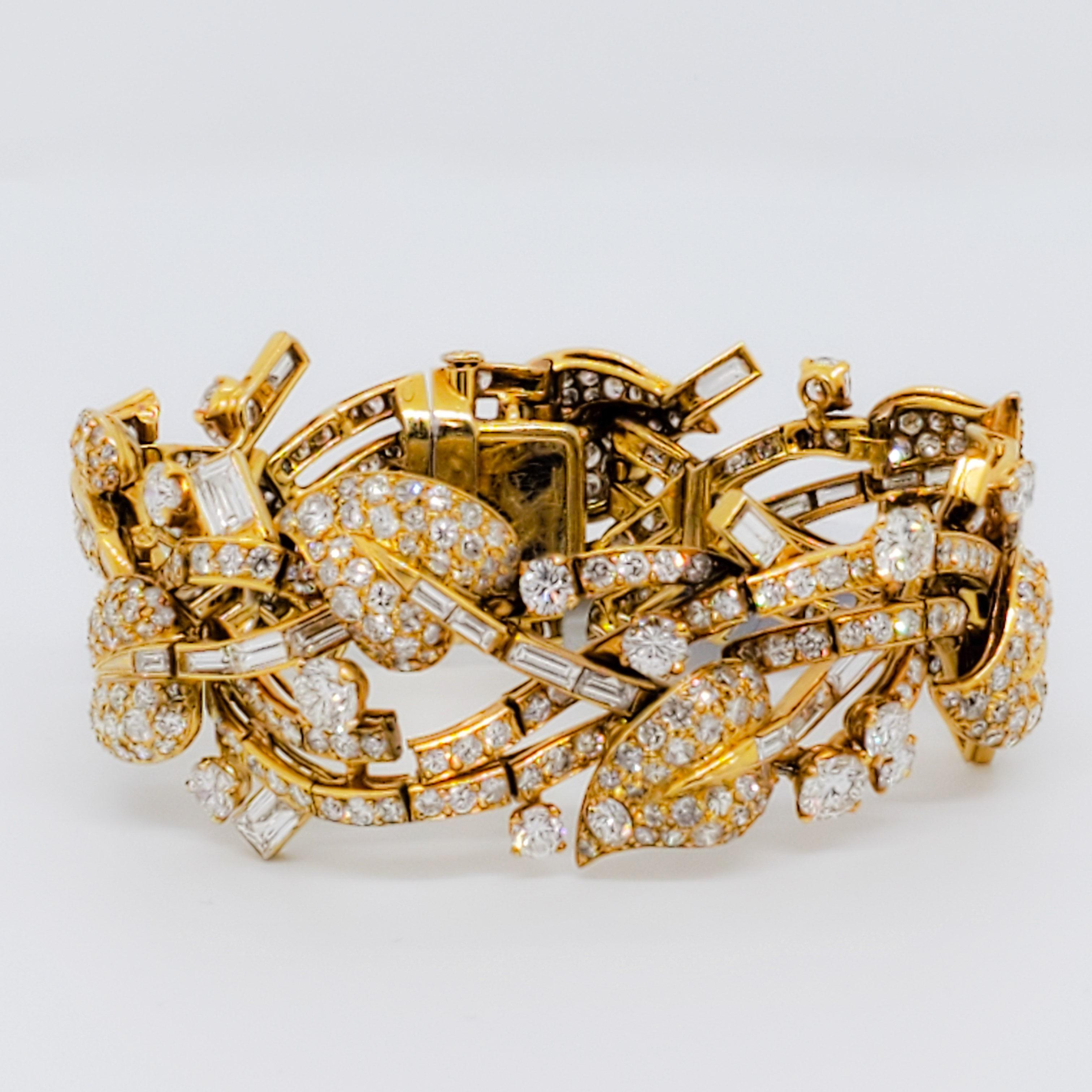 Beautiful cuff bracelet featuring 18.00 ct. of good quality, white, and bright diamond rounds and baguettes. Delicately handmade in 18k yellow gold.