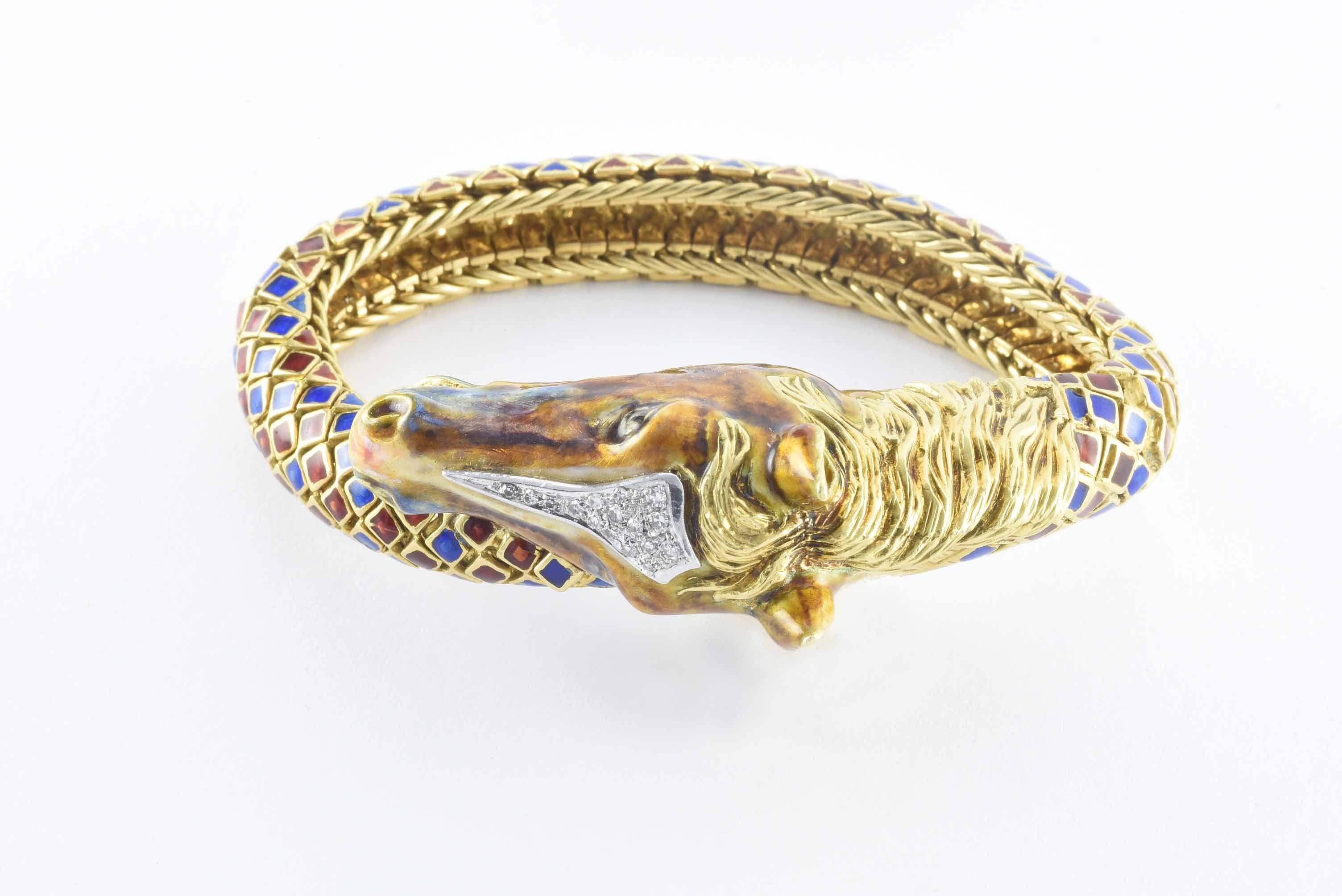 This incredible horse head link bracelet reminiscent of designs by Italian jeweler Frascarolo features an intricately carved 18kt yellow gold horse head embellished with sixteen single cut diamonds totaling approximately 0.25 carats and blue and