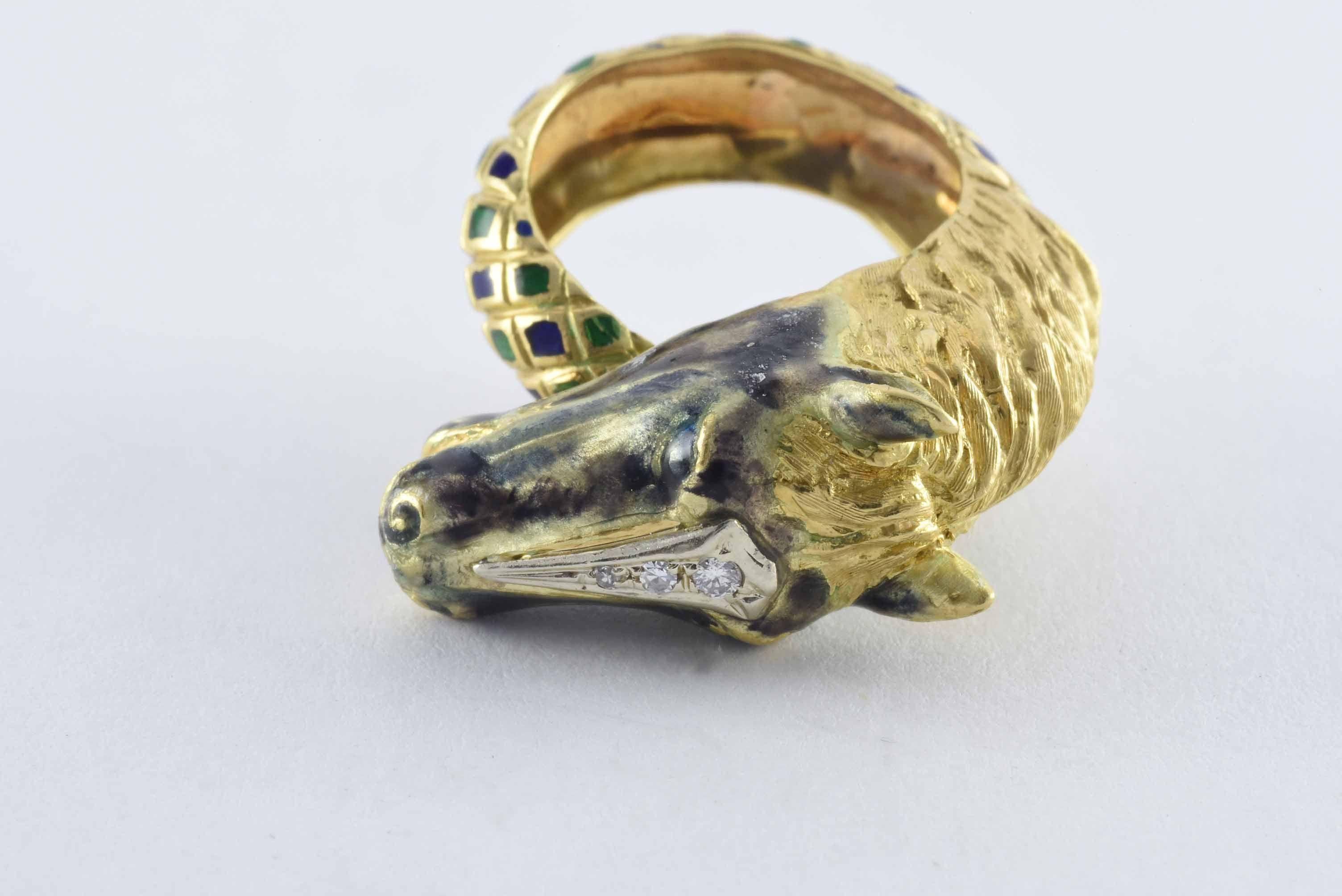 This incredible horse head ring reminiscent of designs by Italian jeweler Frascarolo features an intricately carved 18kt yellow gold horse head embellished with three single cut diamonds totaling approximately 0.10 carats and a golden mane connected