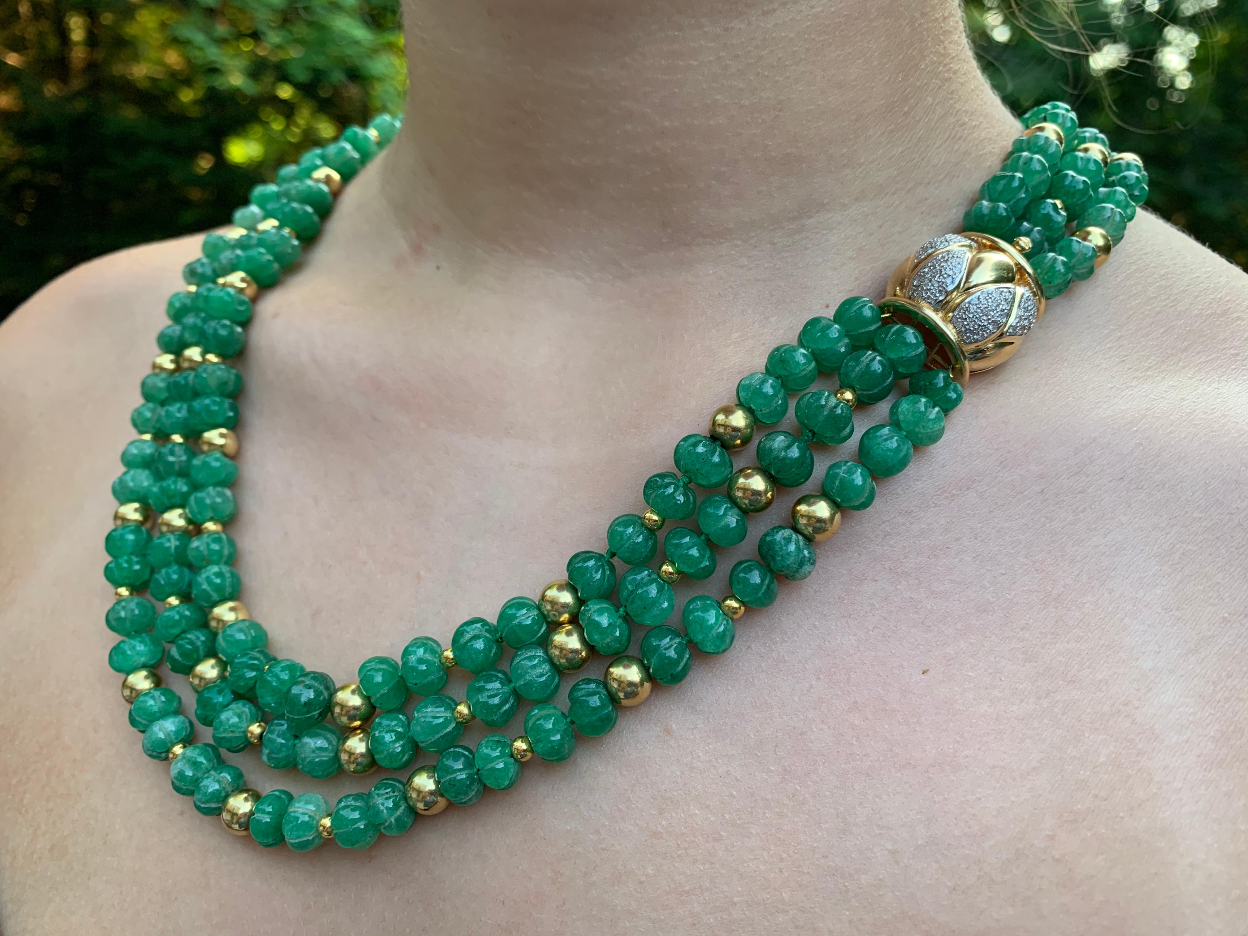 Spectacular designer signed triple strand necklace composed of 195 hand carved melon shaped chrysoprase beads interspersed with 91 18K gold beads, 46 6mm and 45 3mm, with a large, ornate substantial 18k gold and diamond closure which may be worn as