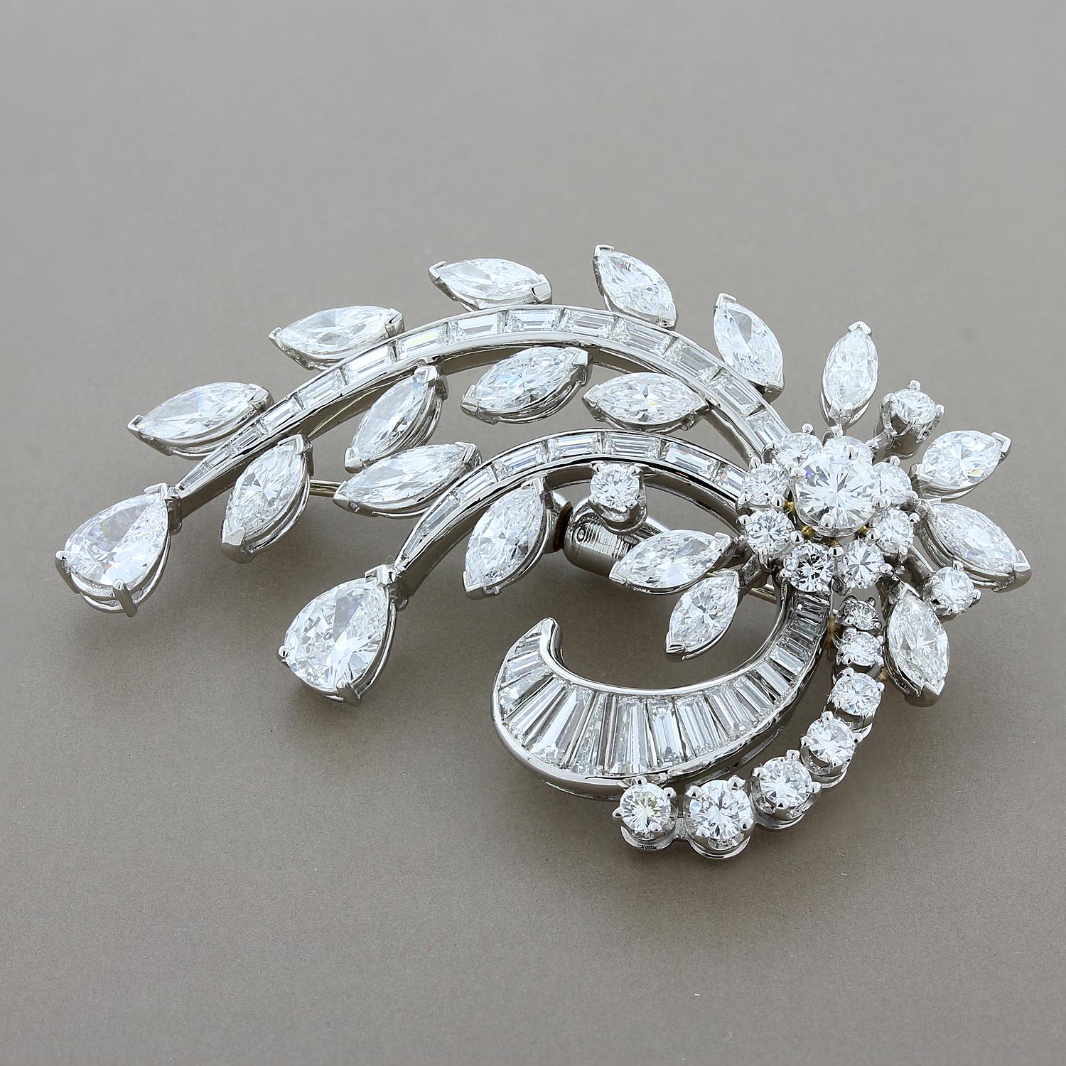 An alluring brooch with a flower cluster and draping leaves made from 9.29 carats of top-grade VS quality white diamonds. Pear cut, round cut, marquise cut and baguette cut diamonds are all used to make this stunning design in platinum.

Brooch