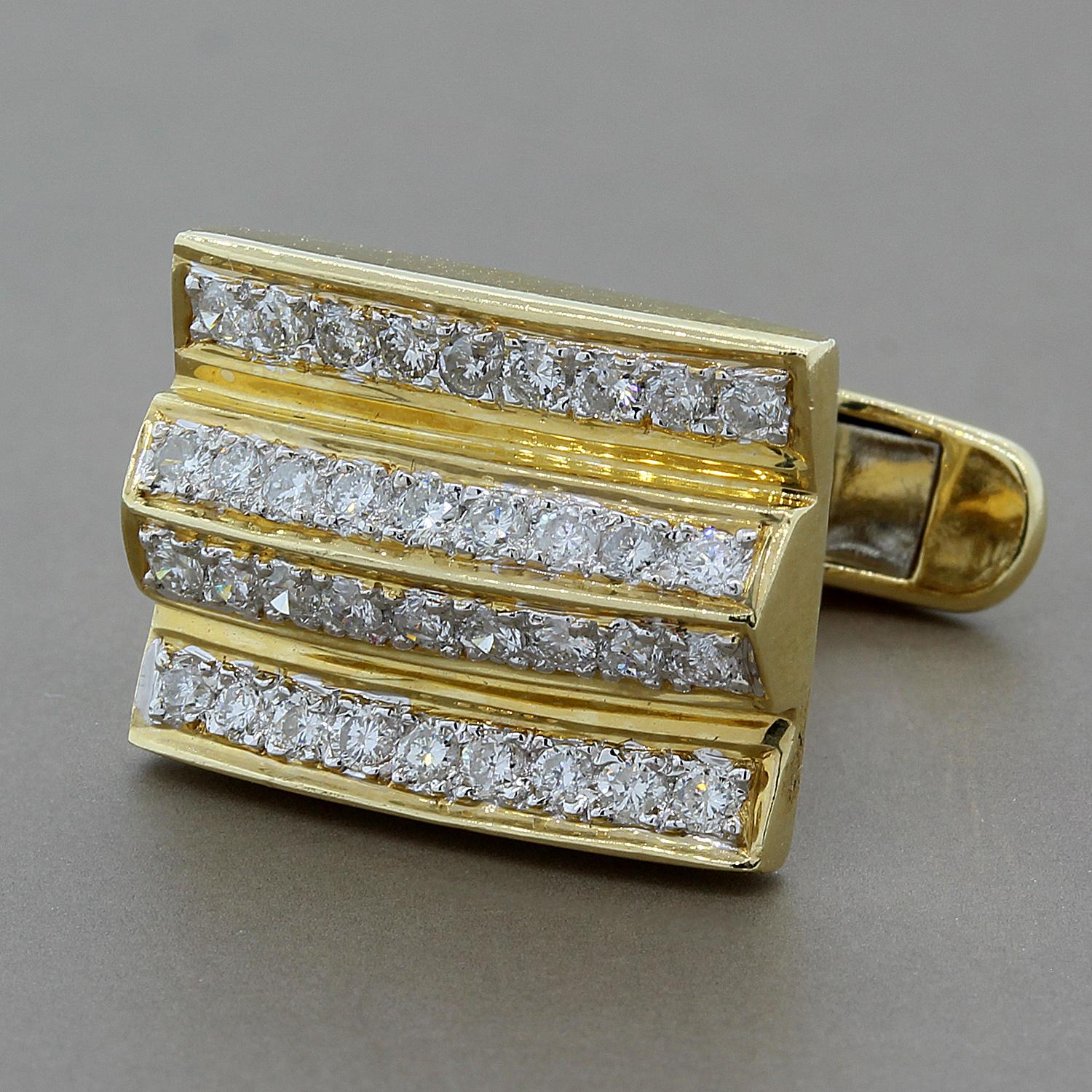 A pair of cufflinks featuring 1.30 carats of round cut diamonds on a special design in 14K yellow gold.  These are sure to dress up any suit.