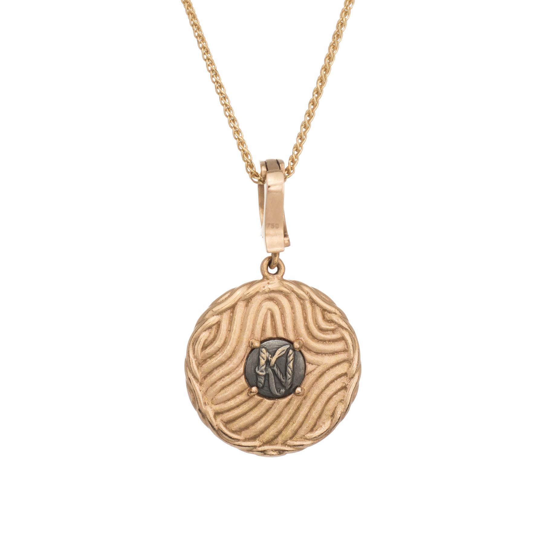 Elegant and finely detailed heart pendant & necklace, crafted in 18 karat yellow gold (pendant) and 14 karat yellow gold (necklace).  

Round brilliant cut diamonds total an estimated 0.23 carats (estimated at F-G color and VS1 clarity).   

The