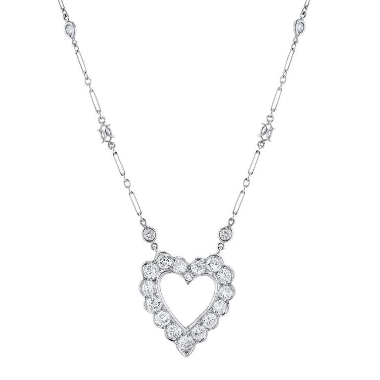 This exquisite Diamond Platinum and White Gold Estate Necklace is crafted with a platinum chain, 14K white gold pendant, and a 14K white gold clasp. The diamonds featured total approximately 3.34 carats.
The heart measures almost 1 inch long. 
Each