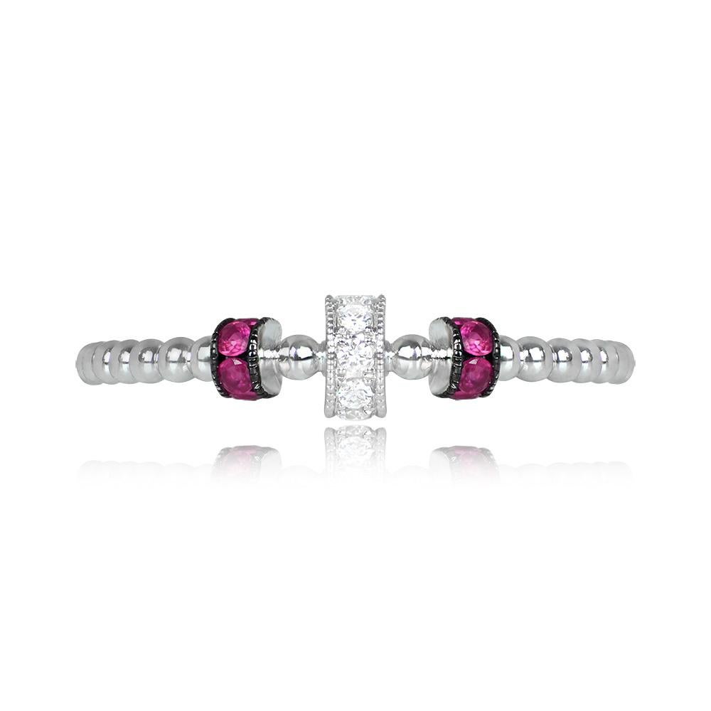 A handcrafted 18k white gold band adorned with a beaded design. Featuring round brilliant-cut diamonds and round-cut rubies set along rolled sections, the total diamond weight is approximately 0.04 carats, and the rubies weigh approximately 0.11