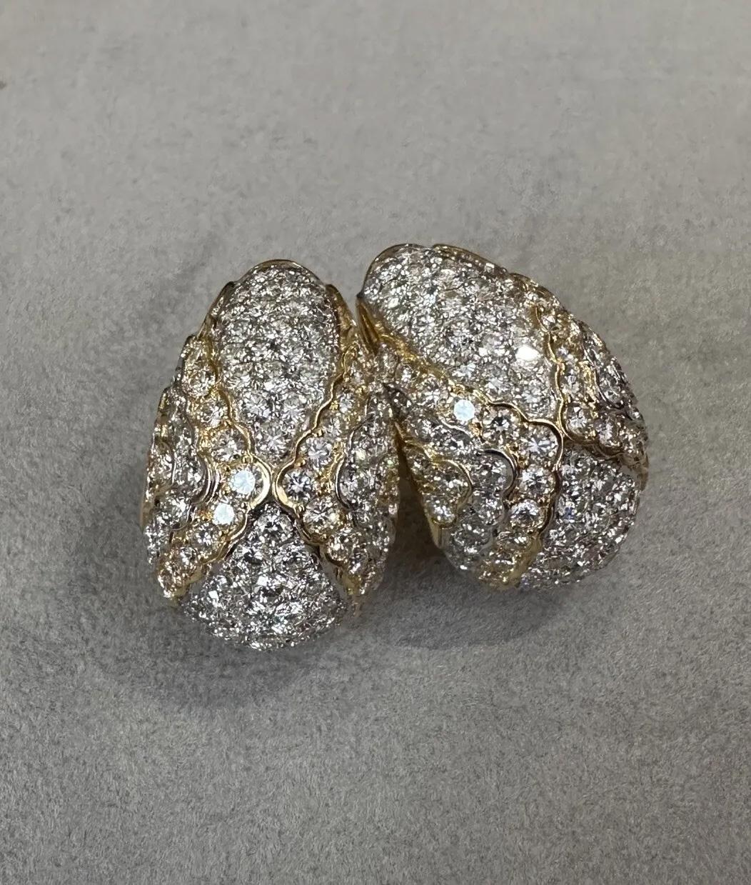 Estate Diamond Pave Drop Earrings 7.40 Carat Total Weight in 18k Yellow Gold 

Diamond Half-hoop Drop Earrings feature 7.40 carats of Round Brilliant Diamonds with a subtle X design Pave set in 18k Yellow Gold.

Total diamond weight is 7.40