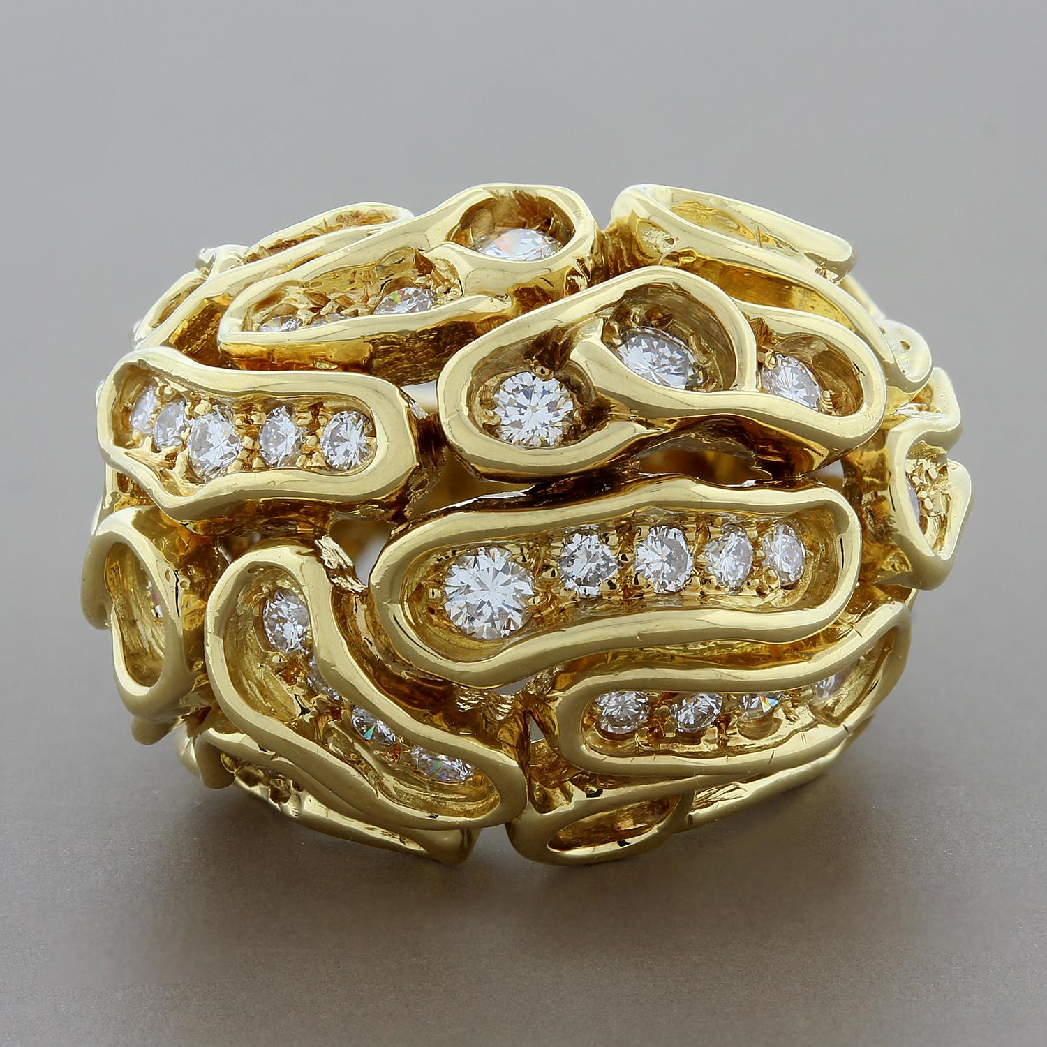 This stylish and elegant estate cocktail ring features 1.65 carats of round cut VS quality diamonds set in the puzzle like setting. The domed ring is beautifully set in 18K yellow gold with diamonds that go all the way to the very end.

Currently