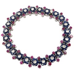 Estate Diamond, Ruby, and Sapphire Retro Style Tennis Bracelet in 18 Karat Gold