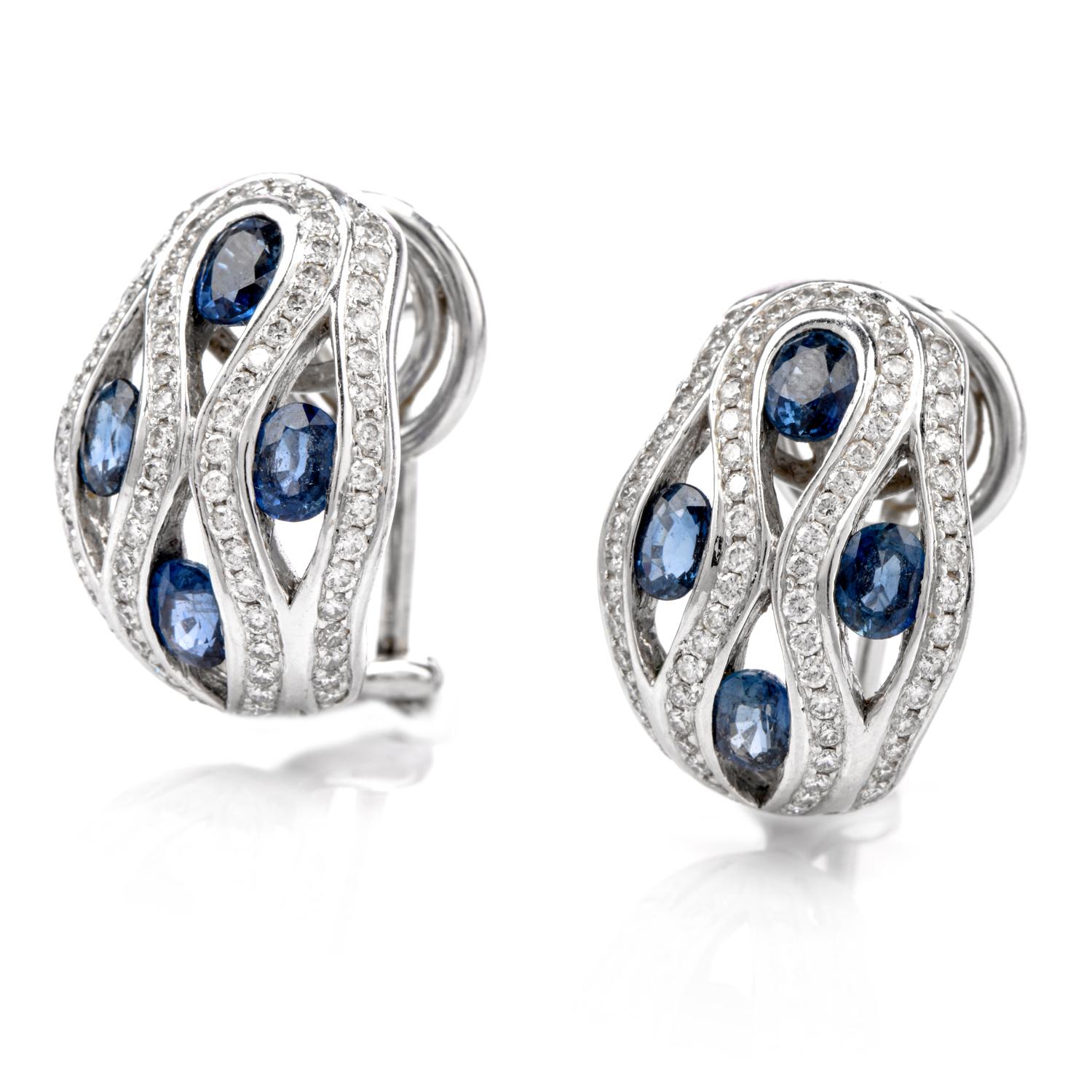 These stunning Diamond and Sapphire Dome Earrings were inspired in a 

flowing water motif and crafted in 18K white gold. 

Vibrant blue oval shaped Sapphire run down

the ear throughout the waves of white Diamonds.

Diamonds weigh appx. 1.05 carat