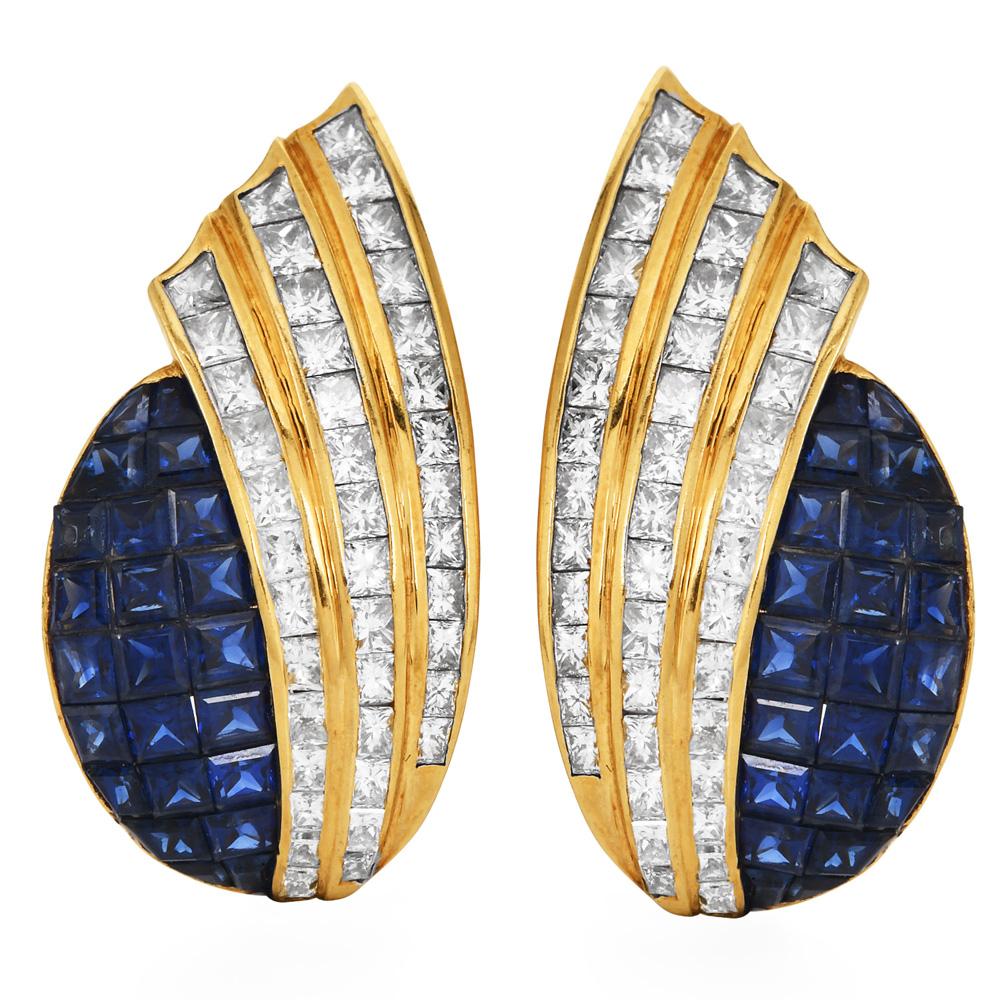Opulent vintage late 1970s 18-karat yellow gold statement clip-on earrings Princess-Cut Diamond and Sapphire Statement Clip-On Earrings, Channel-Set Flair Design.

Masterfully set within their gleaming contours are 6.40 carats of channel-set,