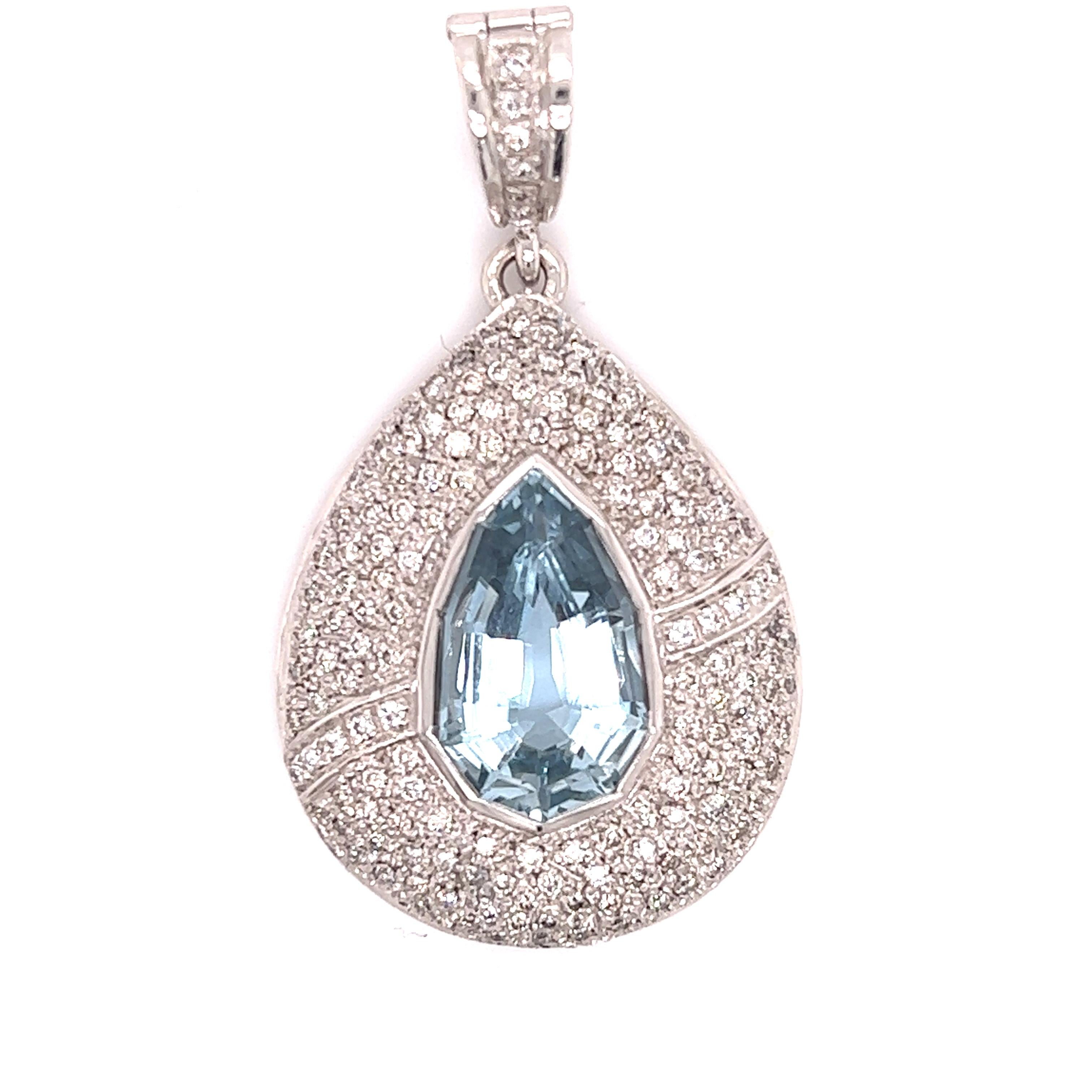 Stand out item for your consideration. This fantastic design is crafted in 18k white gold. The highlight of the pendant is one approximate 8.01 carat aquamarine gemstone cut in a mesmerizing shield shape. The aqua marine has sharp edges and