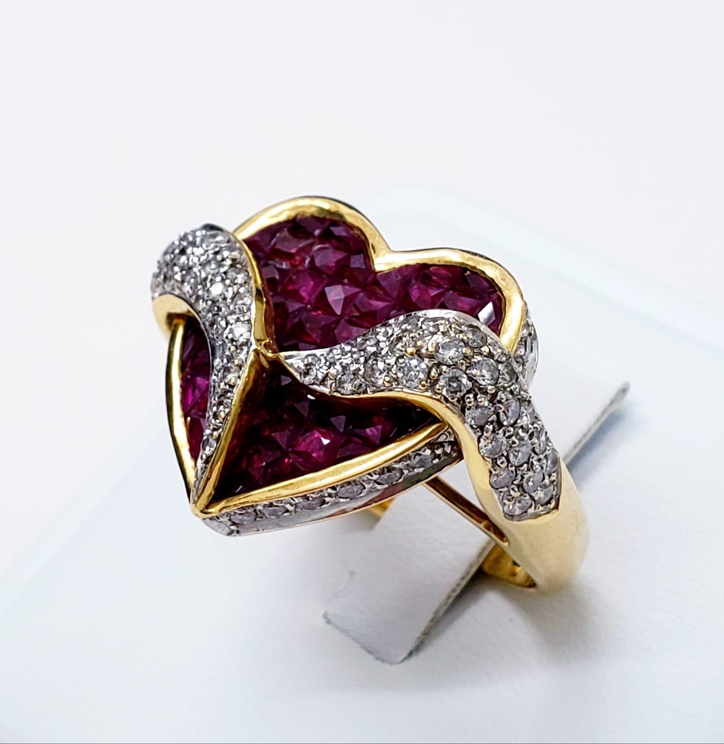 Estate Diamonds 7.10ct Ruby 18k Gold Heart Cluster Cocktail Ring. The total carat weight of the diamonds is 1.10ct & Ruby’s 6 carats total weight. The ring weights 11 grams. The ring measures 25mm X 19mm. The ring size is 5.5
Circa 1980’s