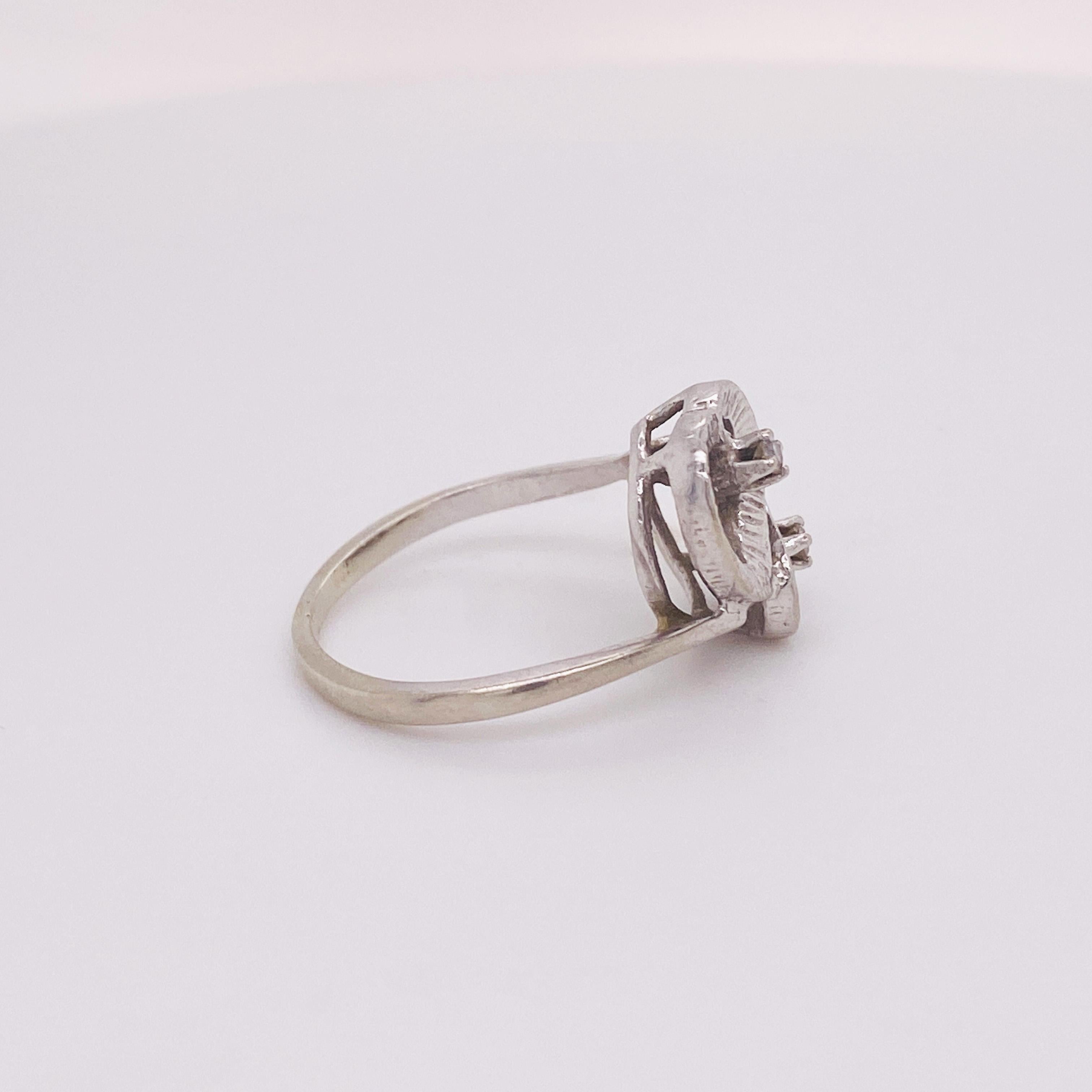 Two hearts intertwined as one forming a yin-yang of love on a bypass band that sweeps around the finger. These gorgeous hand-detailed hearts each have a diamond at the center. This ring would make the perfect gift for your loved one. This ring could