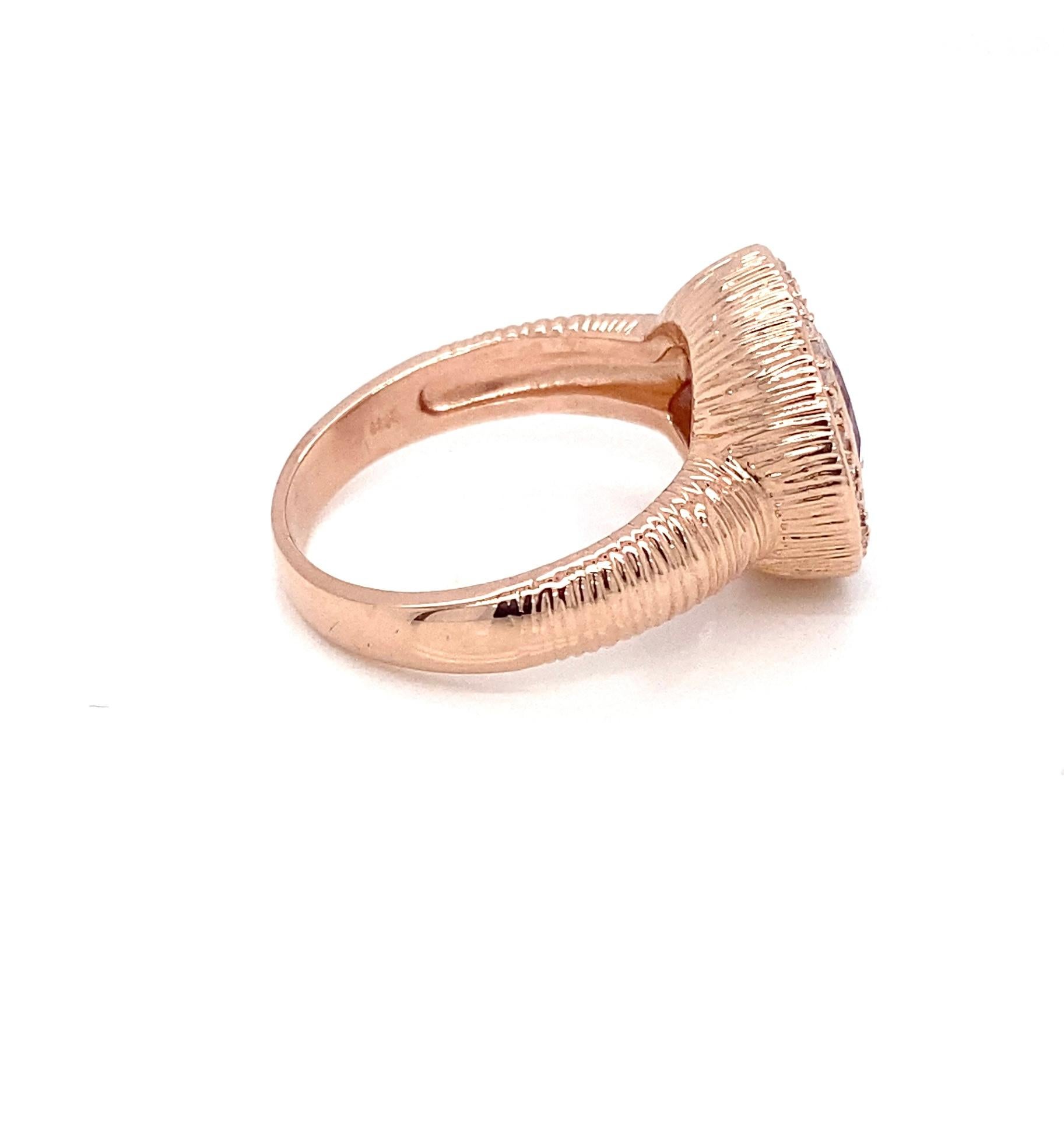 A striking statement piece, this circa 2000s ring showcases a beautifully faceted Rose de France amethyst, approximately 4.00 carats, with its signature soft lavender hue. The oval-shaped gem is securely bezel set at the center of a refined diamond