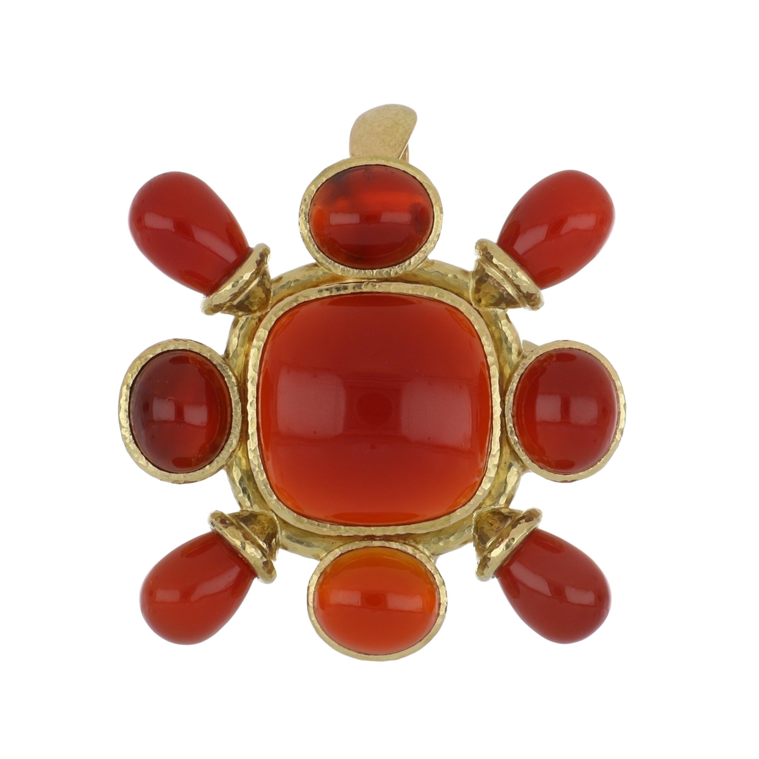 An estate Elizabeth Locke hammered 19K yellow gold cabochon carnelian brooch measuring 1.75 inches x 1.75 inches. This piece has a removable hammered 18K yellow gold open/close bail so it can also be worn as a pendant. Circa 2000.  