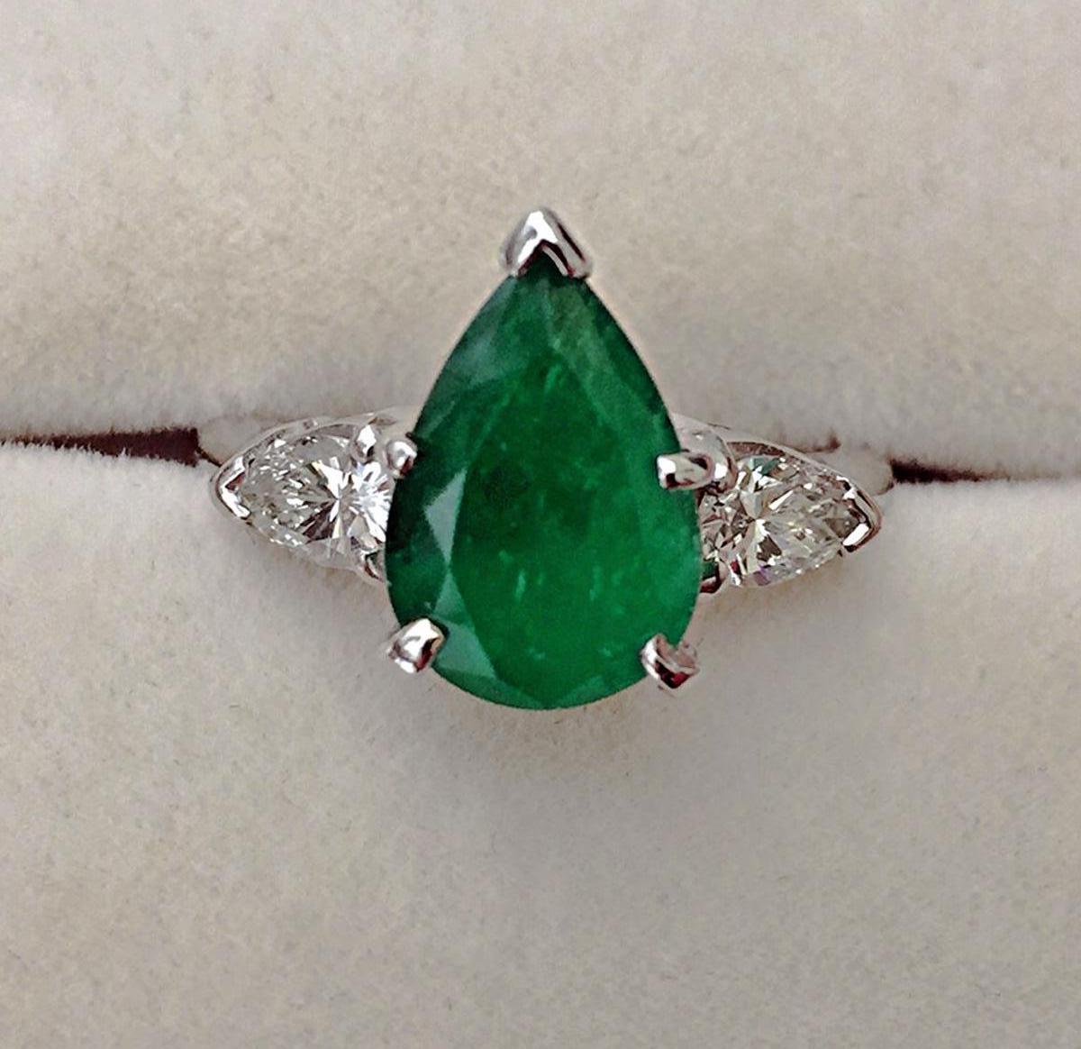 Platinum Emerald & Diamond Engagement Ring 3 Stone Pear Shape 2.76 Carat 
Primary Stones: Natural Colombian Emerald
Shape or Cut : Pear Cut
Average Color/Clarity : Intense AAAA Fine Green Color/Clarity VS
Total Emerald Weight : 2.20 Carats  
Other