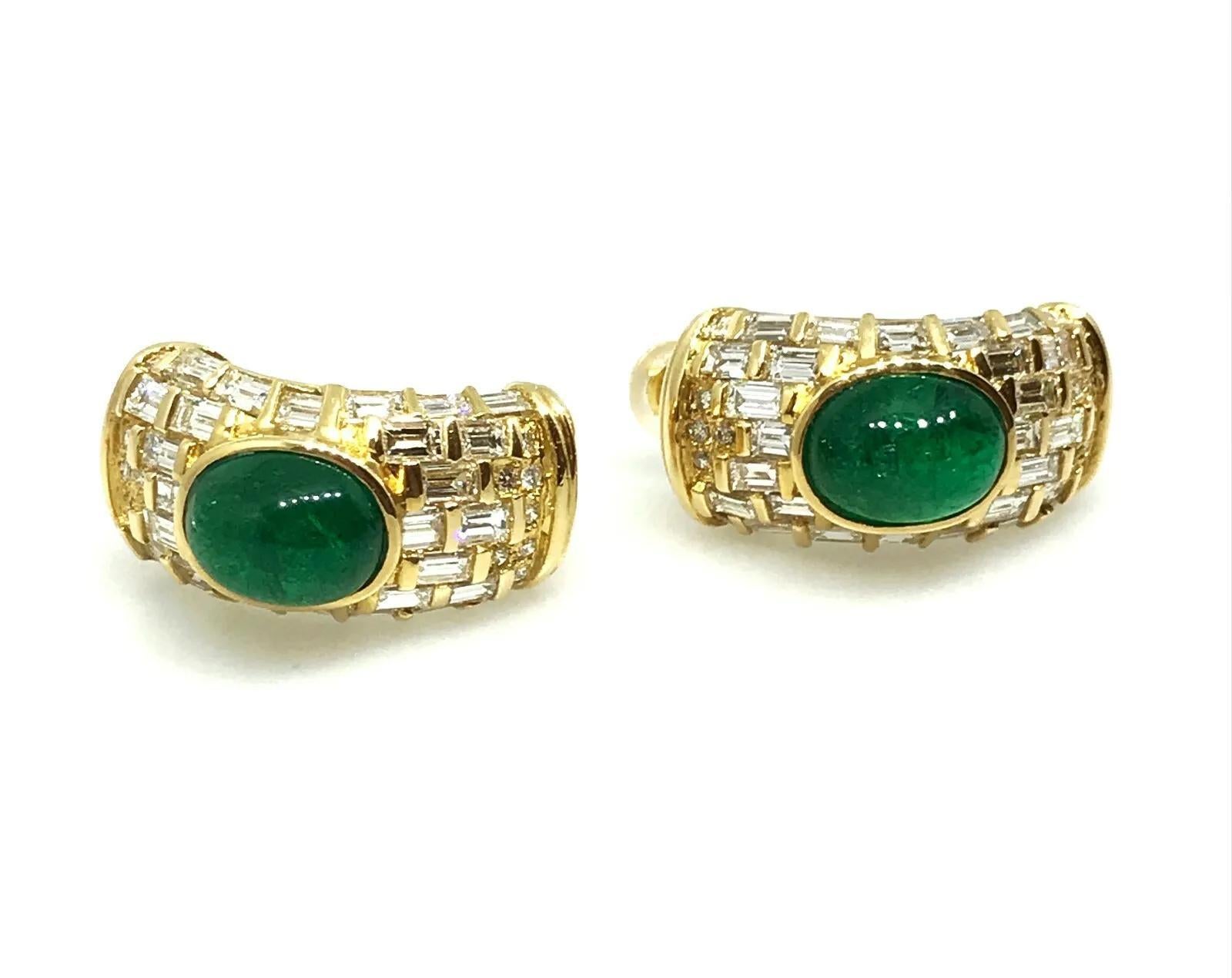Emerald Cabochons and Diamond Earrings features 2 Oval shaped Emerald cabochons in the center accented by 60 Baguettes and 22 round brilliant diamonds set in 18k Yellow Gold. Earrings have post backs for pierced ears.

Total emerald weight is 4