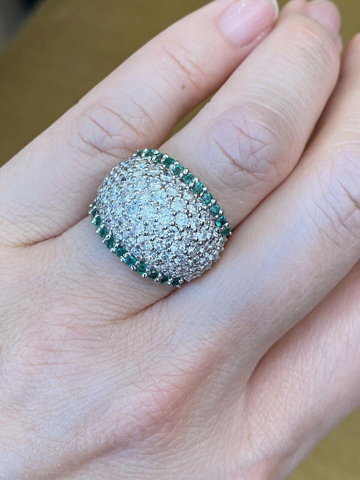 Emerald and Diamond Pavé Dome Ring in Platinum

Emerald and Diamond Pavé Dome Ring features 22 bright and lively Green Round Emeralds in two rows along the edge of the ring complemented by 3.36 carats of Round Diamonds in five rows across the middle