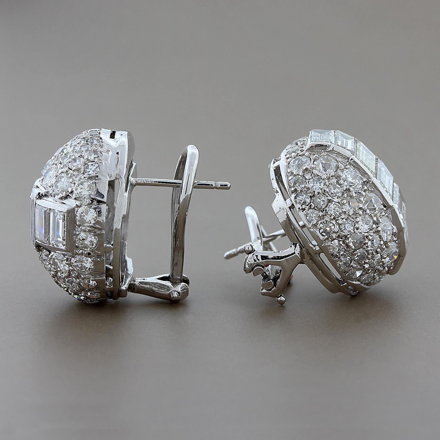 10 carats of emerald and old round cut diamonds are featured in these earrings. The diamonds are VS clarity and G-H color. Graduating emerald cut diamonds run the center in a channel setting, while prong set old round cut diamonds surround. The