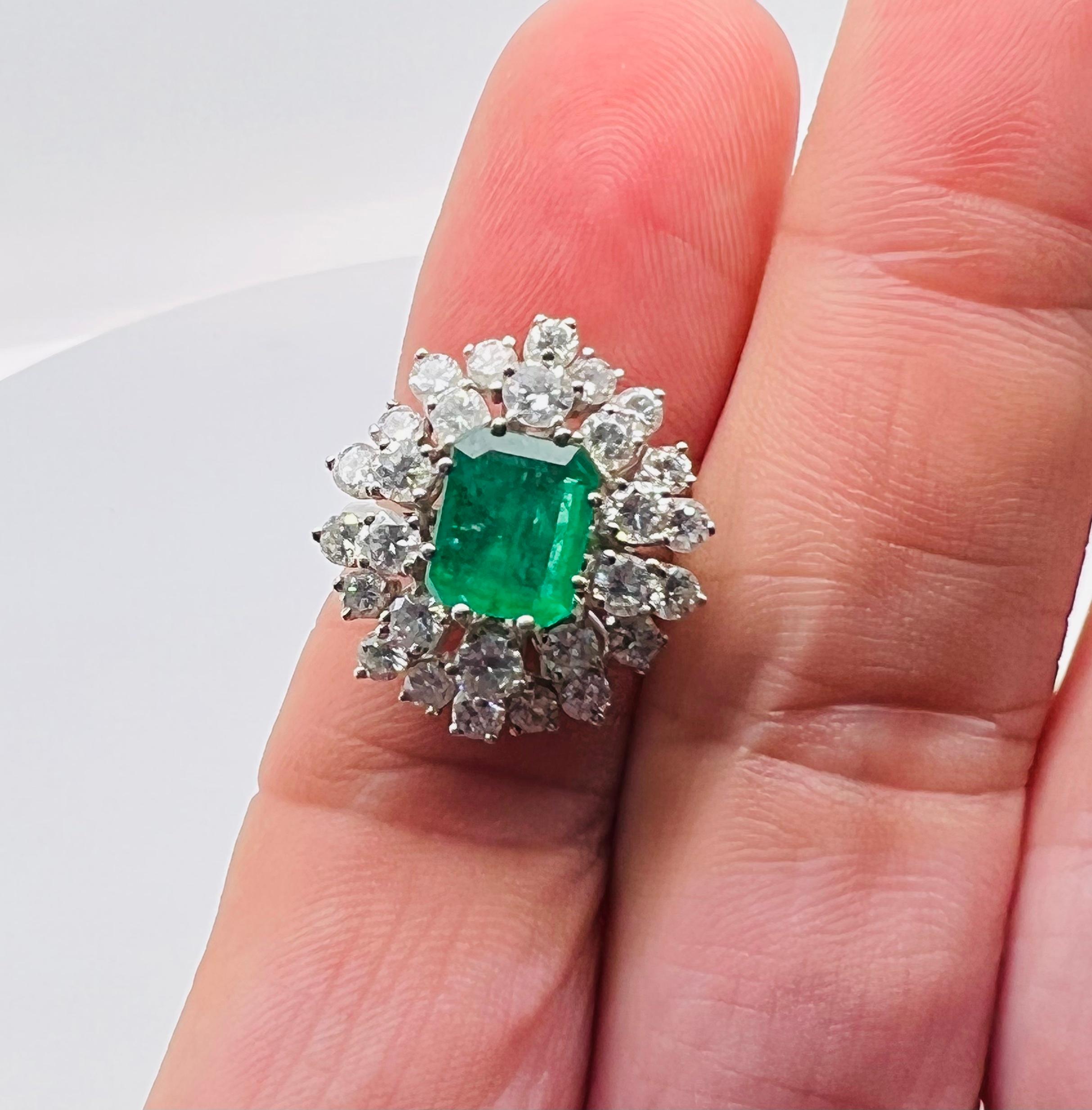Beautiful ring crafted in 18k white gold. The ring is highlighted with one vivid green color emerald gemstone. The gemstone is of Colombian variety and weighs approximately 3.01 carat. The emerald pops with color and is accented with round brilliant