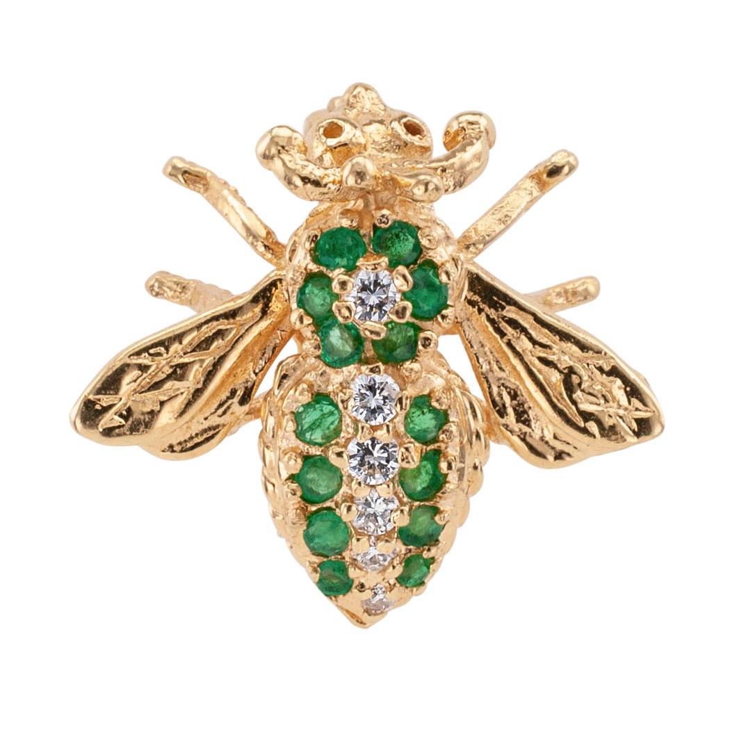 Estate emerald and diamond yellow gold bee brooch circa 1980.

DETAILS:
GEMSTONES:  fourteen faceted round emeralds.
DIAMONDS:  six round brilliant-cut diamonds totaling approximately 0.17 carat.
METAL:  14-karat yellow gold.
MEASUREMENTS: 