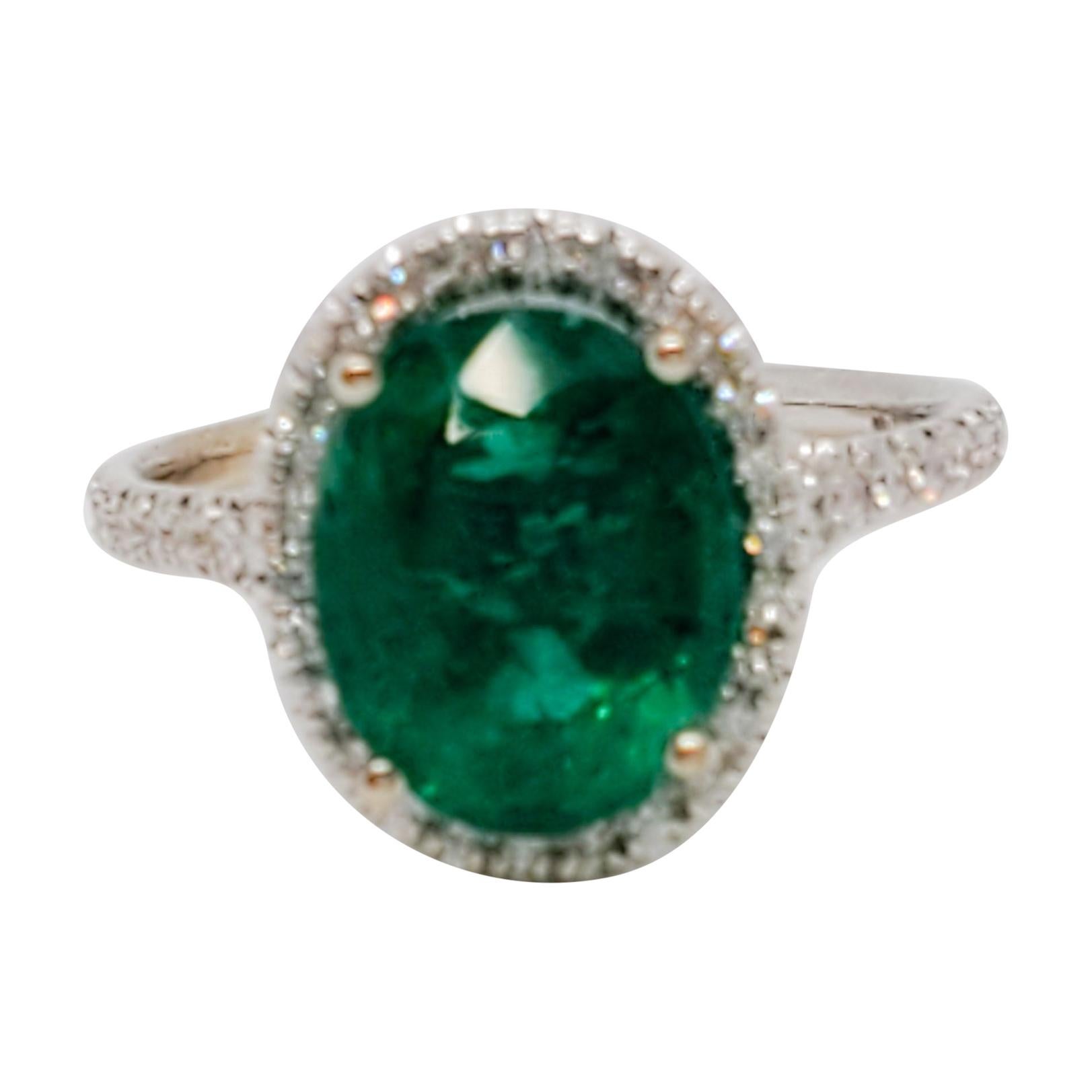 Estate Emerald Oval and White Diamond Round Cocktail Ring in 18 Karat White Gold