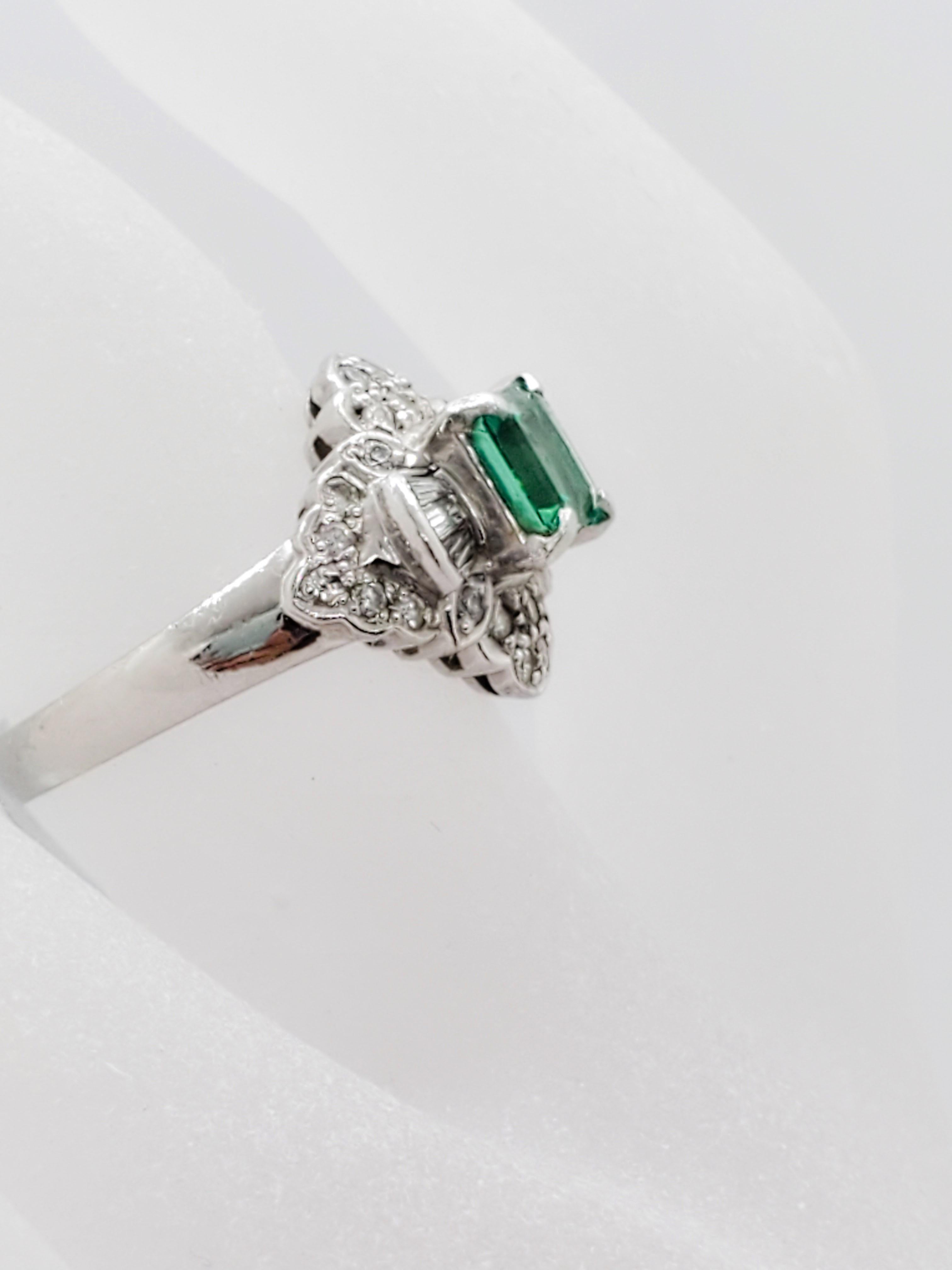 Elegant estate 0.75 ct emerald square with 0.46 ct white diamond baguettes and rounds.  Handcrafted in a platinum mounting.  Ring size 5.5.