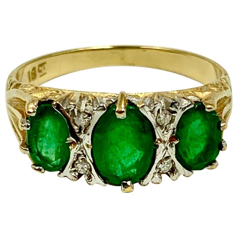 Estate Emerald Three-Stone Ring, 18 Karat Yellow Gold and Diamonds For Sale