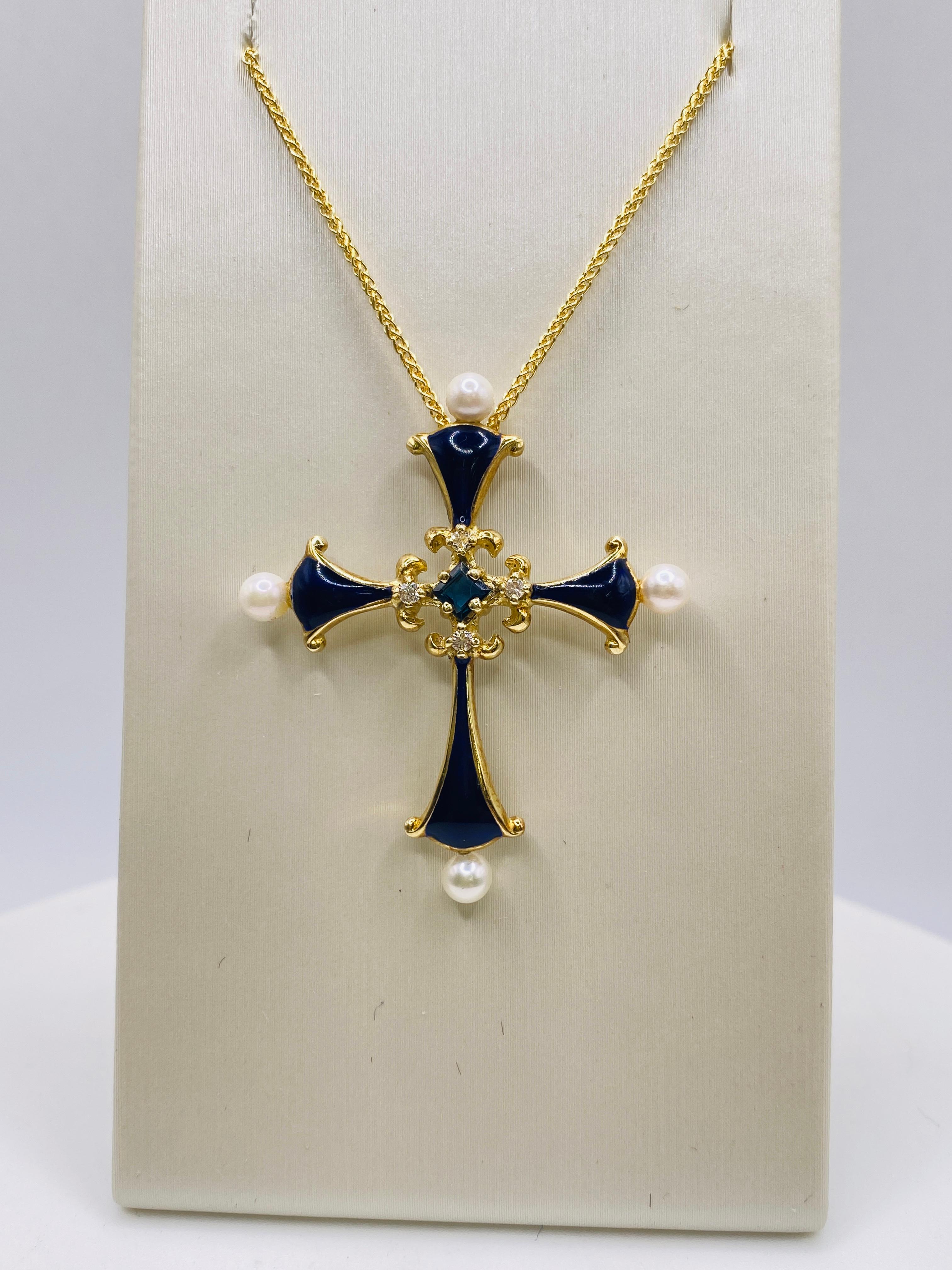 Estate enamel 14k yellow gold cross with 1= center sapphire, 4=diamonds, 4=pearls. Measures 1.5x1 inch. Chain is sold separately.