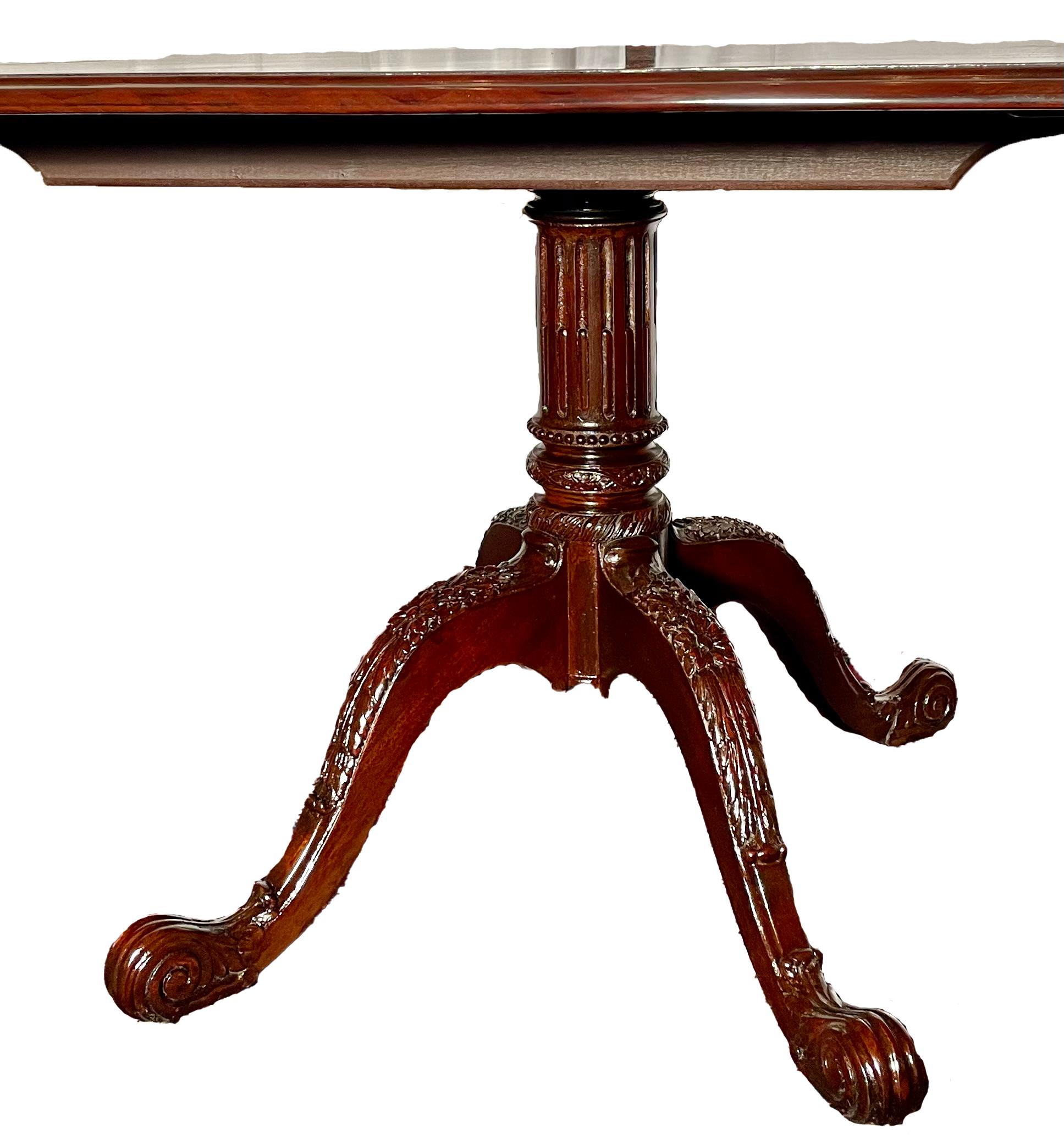 Fine Estate English Solid Mahogany Three-Pedestal Dining Table, circa 1950-1970.
Shown fully extended at 12ft 3in long.  There are 2 Leaves each 21 inches wide.