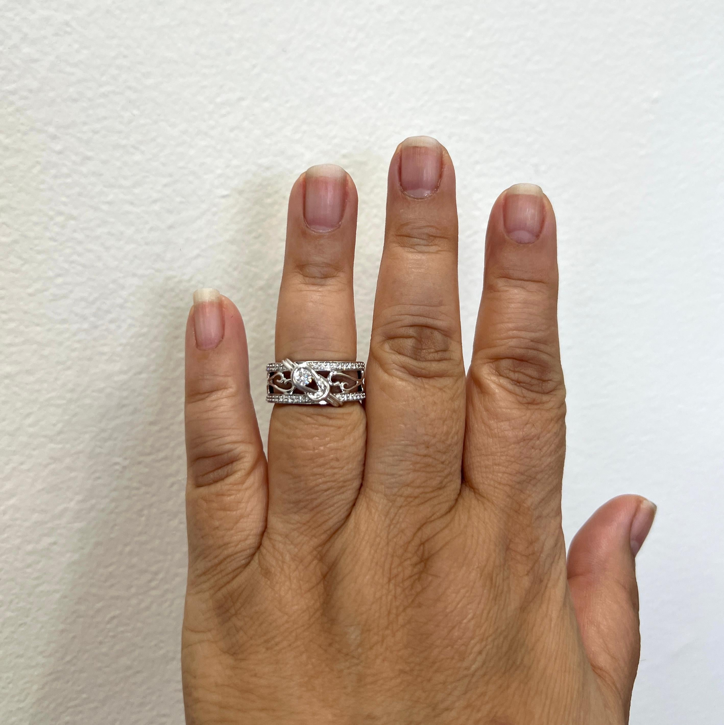 Beautiful estate Everion diamond ring with 0.37 ct. good quality white diamond rounds.  Handmade in 14k white gold.  Ring size 7.