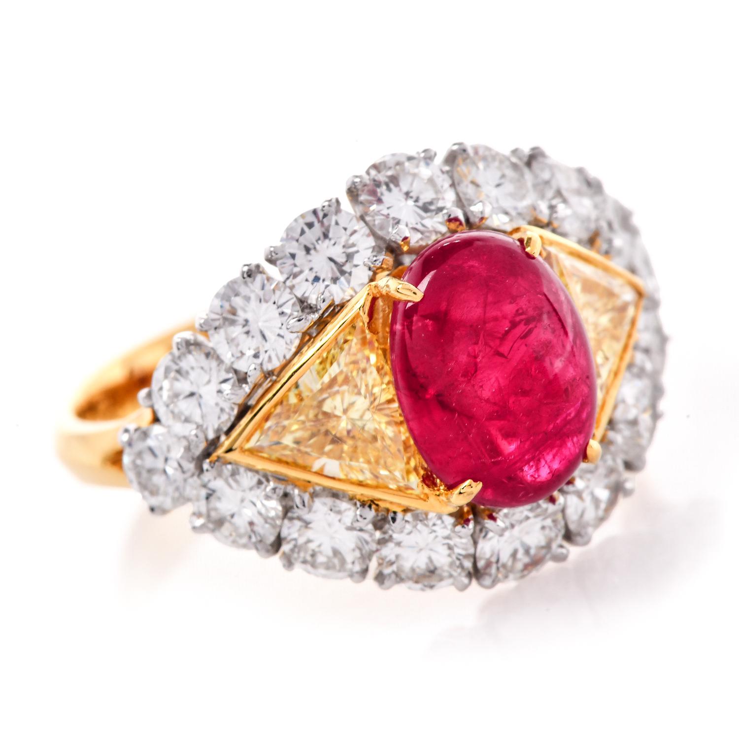 This exquisite ring with cabochon ruby is flanked by triangular-cut fancy yellow diamonds and framed by brilliant round diamonds.

The beautiful cabochon ruby, weighs approximately 2.85 carats, with a deep-red hue.

The Certified ruby is framed by