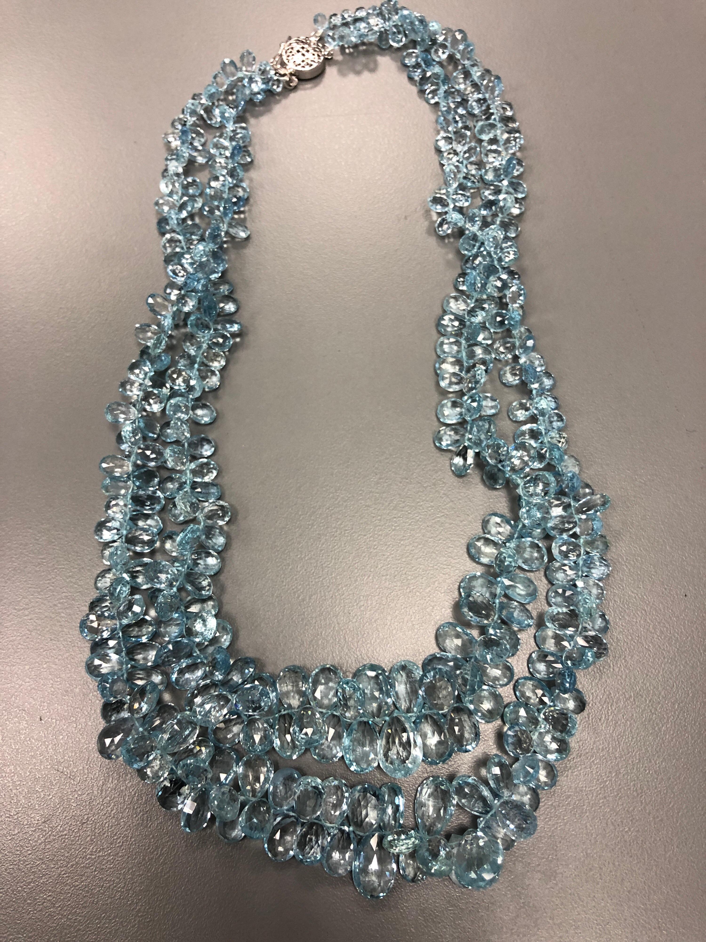 The necklace which contains approximately over 400 carats of fine faceted aquamarine beads, eye clean and with a lovely saturated blue color, measures 18 inches long with the second strand dropping to 20 inches. It terminates to a 14K white gold