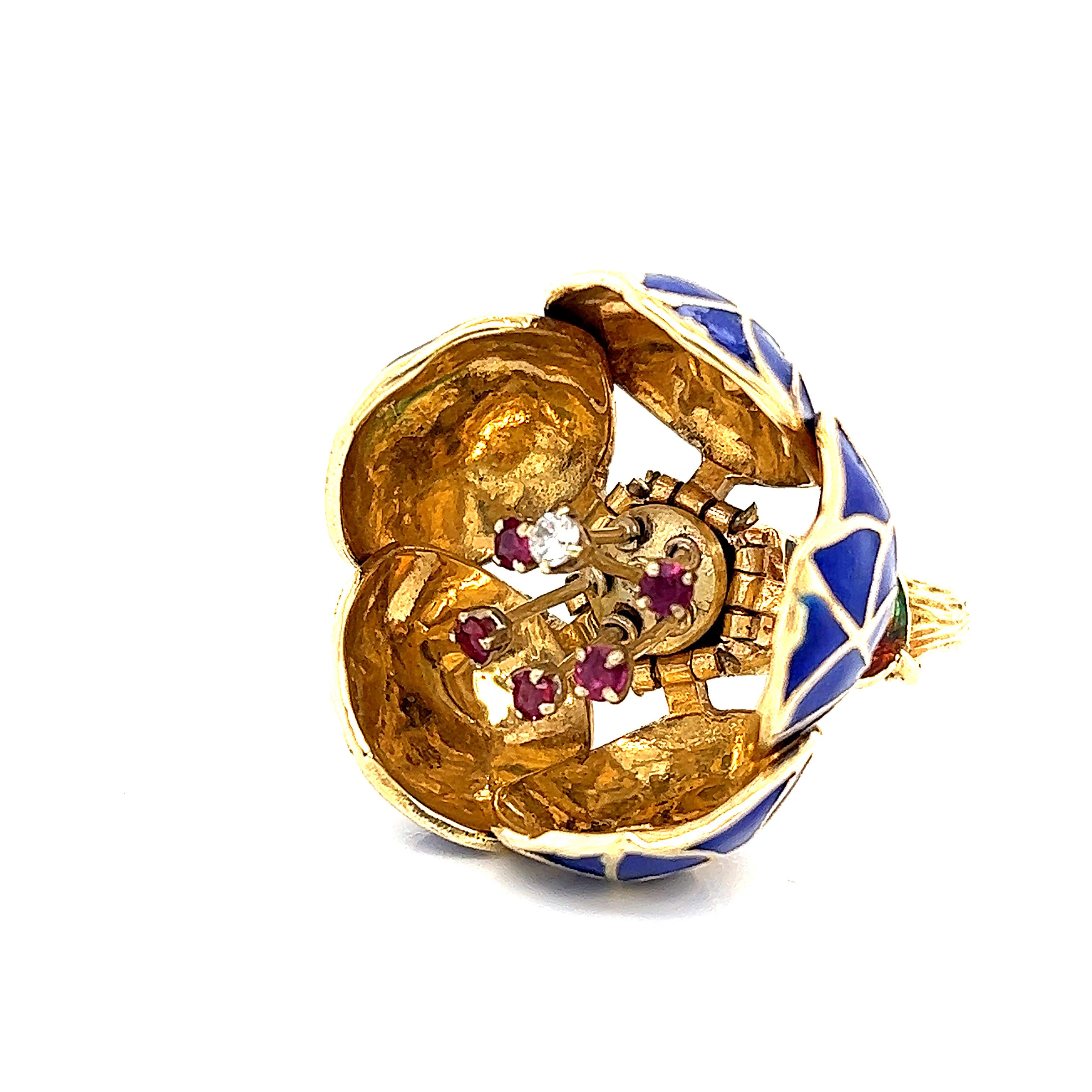 Gorgeous floral design crafted in 15k yellow gold. This amazing ring has two different styles it can be worn as. The ring rests as a closed flower with blue enamel decorating the petals. The ring is functional as it opens up to show a flower in full