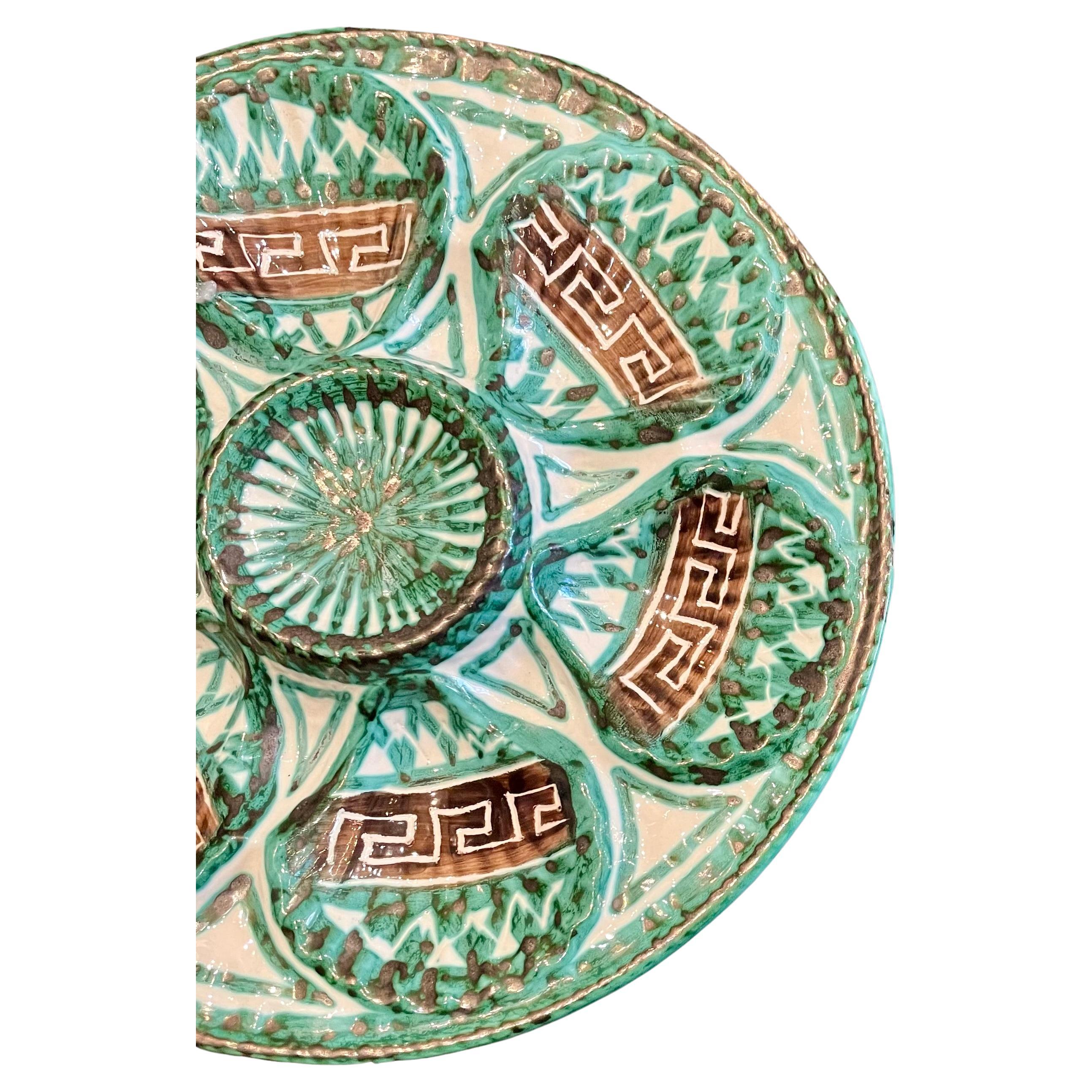 Estate French faience hand-painted porcelain oyster plate, circa 1960's.
Lively green and brown design on an ivory background.  