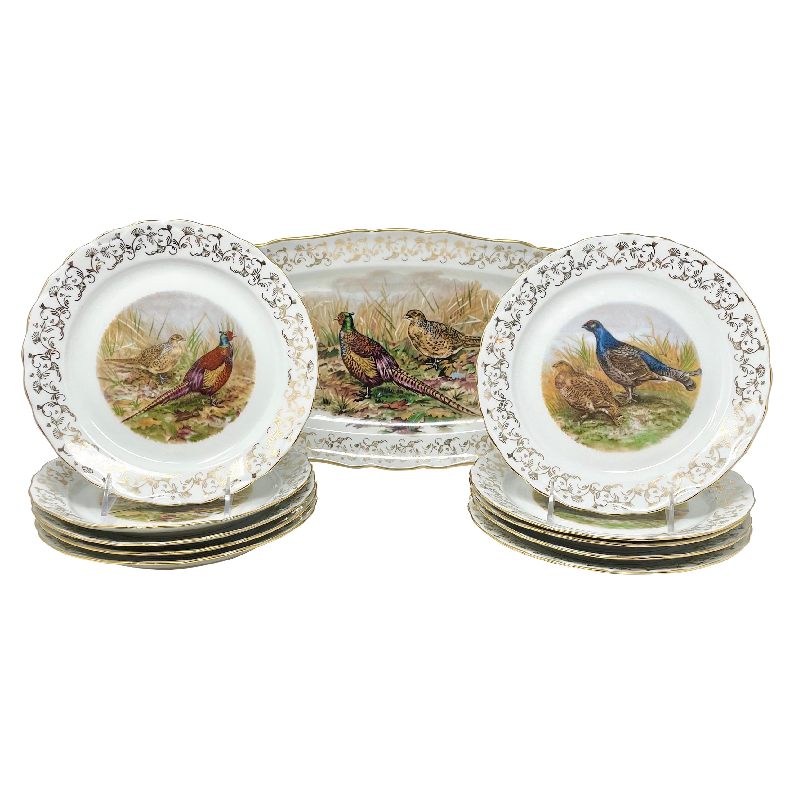 Service de 11 pièces en porcelaine de Limoges, 10 assiettes et 1 plateau
