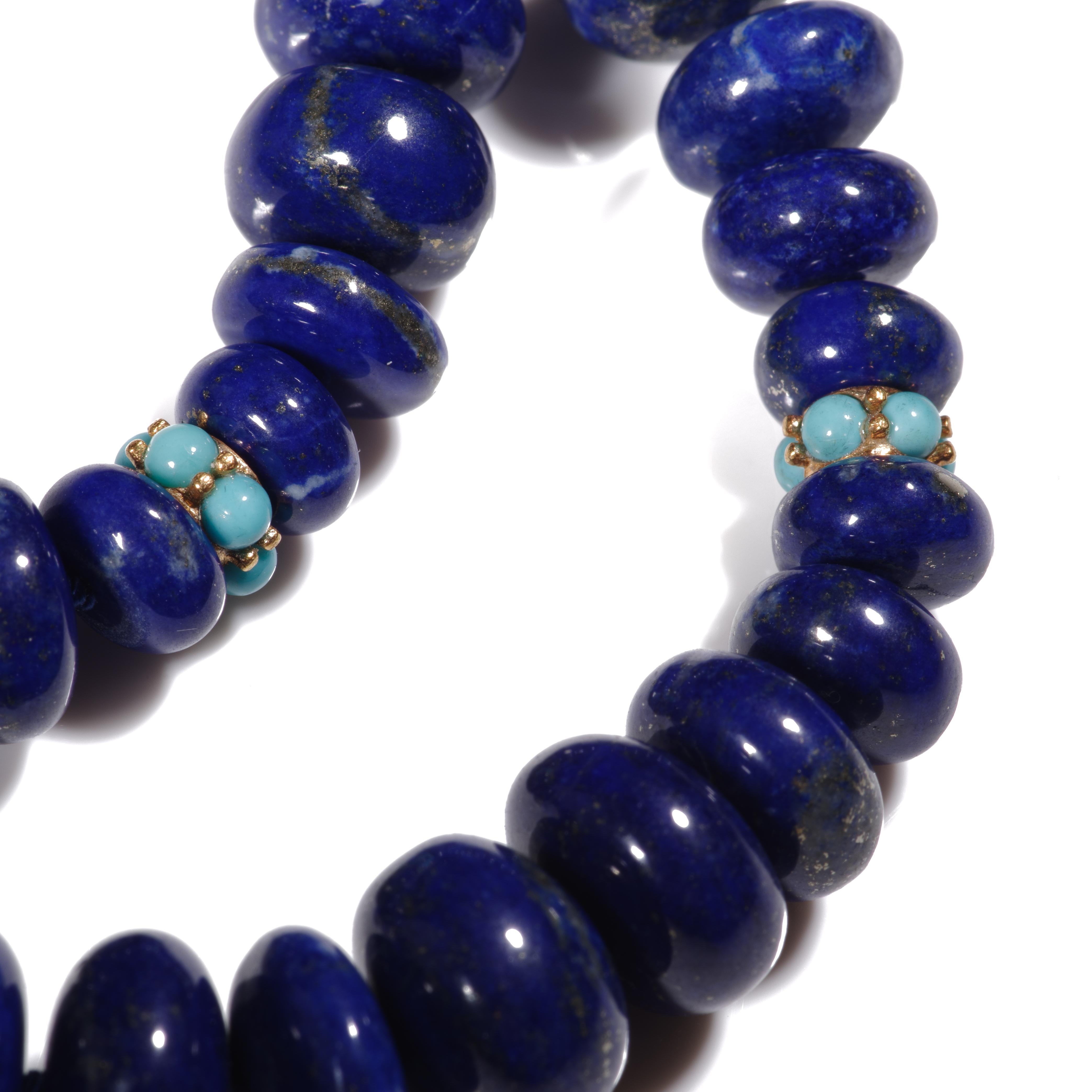 A regal giant royal blue Lapis Lazuli necklace with extremely rare and finest quality Lapis in an exceptional large size and very rare enchanting color. Finished with a sparkling gold sleeping beauty turquoise bead and a cute yellow gold bow clasp.