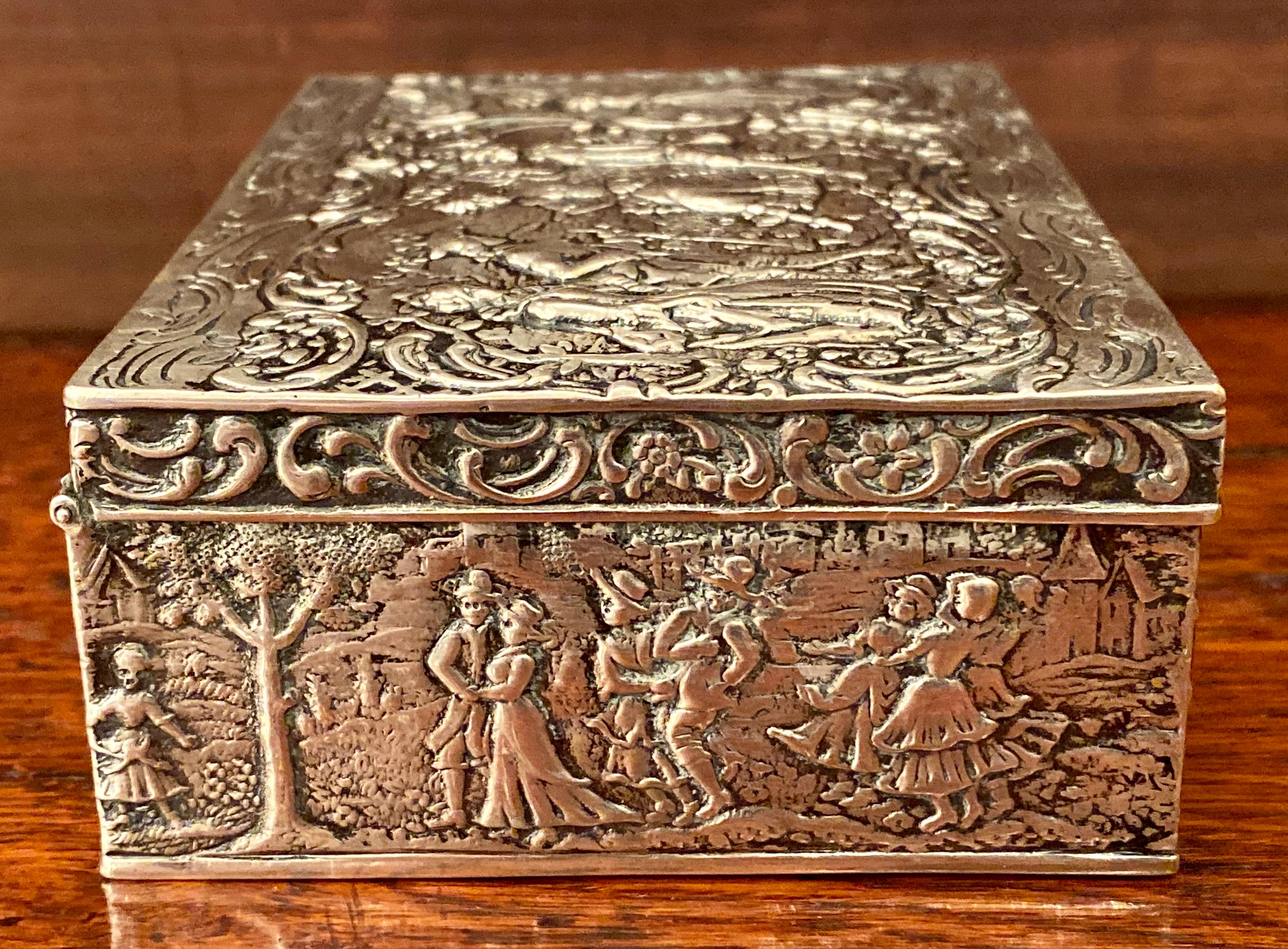 Estate German continental silver repoussee jewelry box, circa 1920s.
Bottom is Hallmarked with a Crescent Moon and 800 denoting the piece as 800 silver.