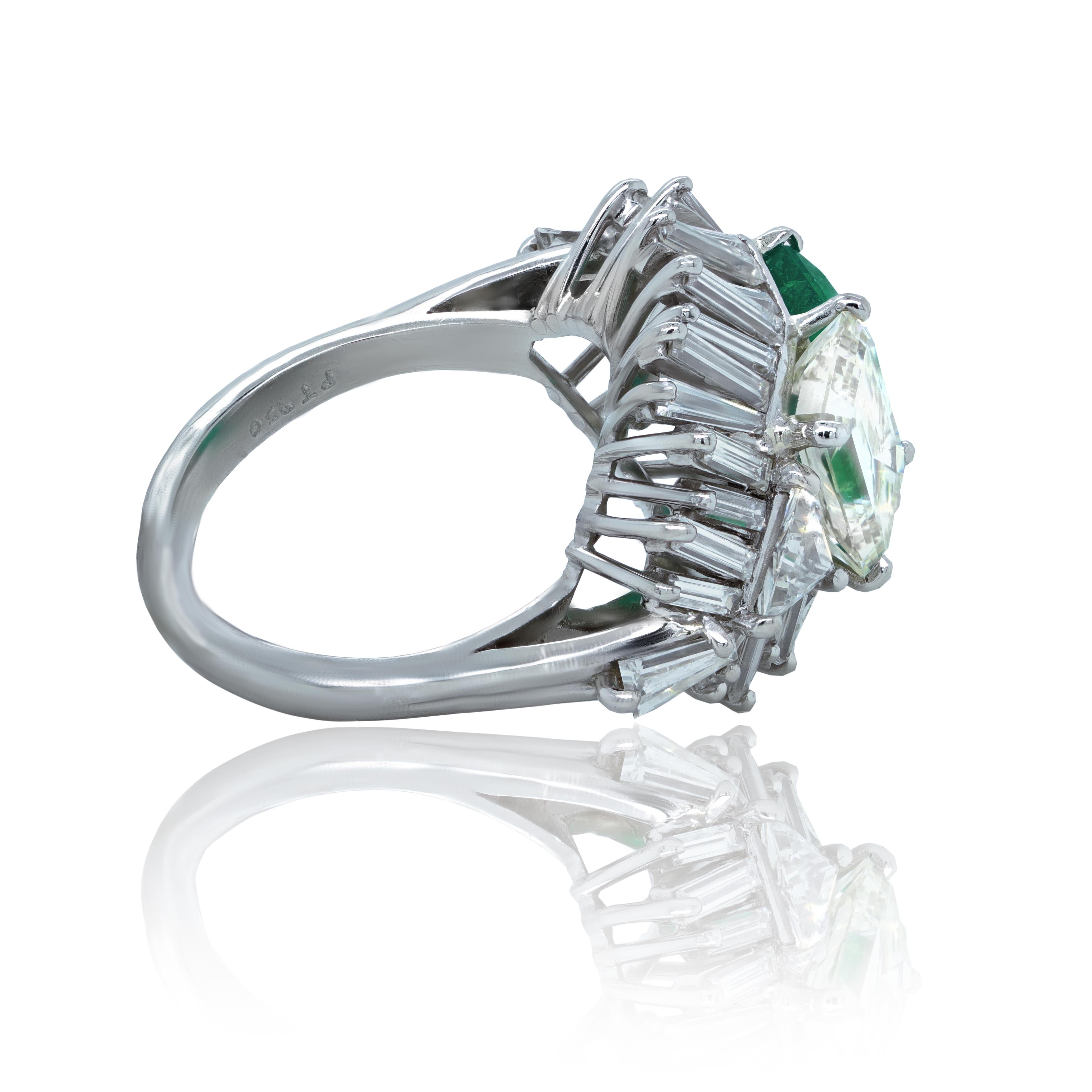 Platinum Estate Green emerald and diamond ring, feature 2.15 Carat Emerald cut Emerald set with 2.05 Carat GIA Certified Emerald cut diamond, surrounded by 1.95 carats of baguette diamonds. 