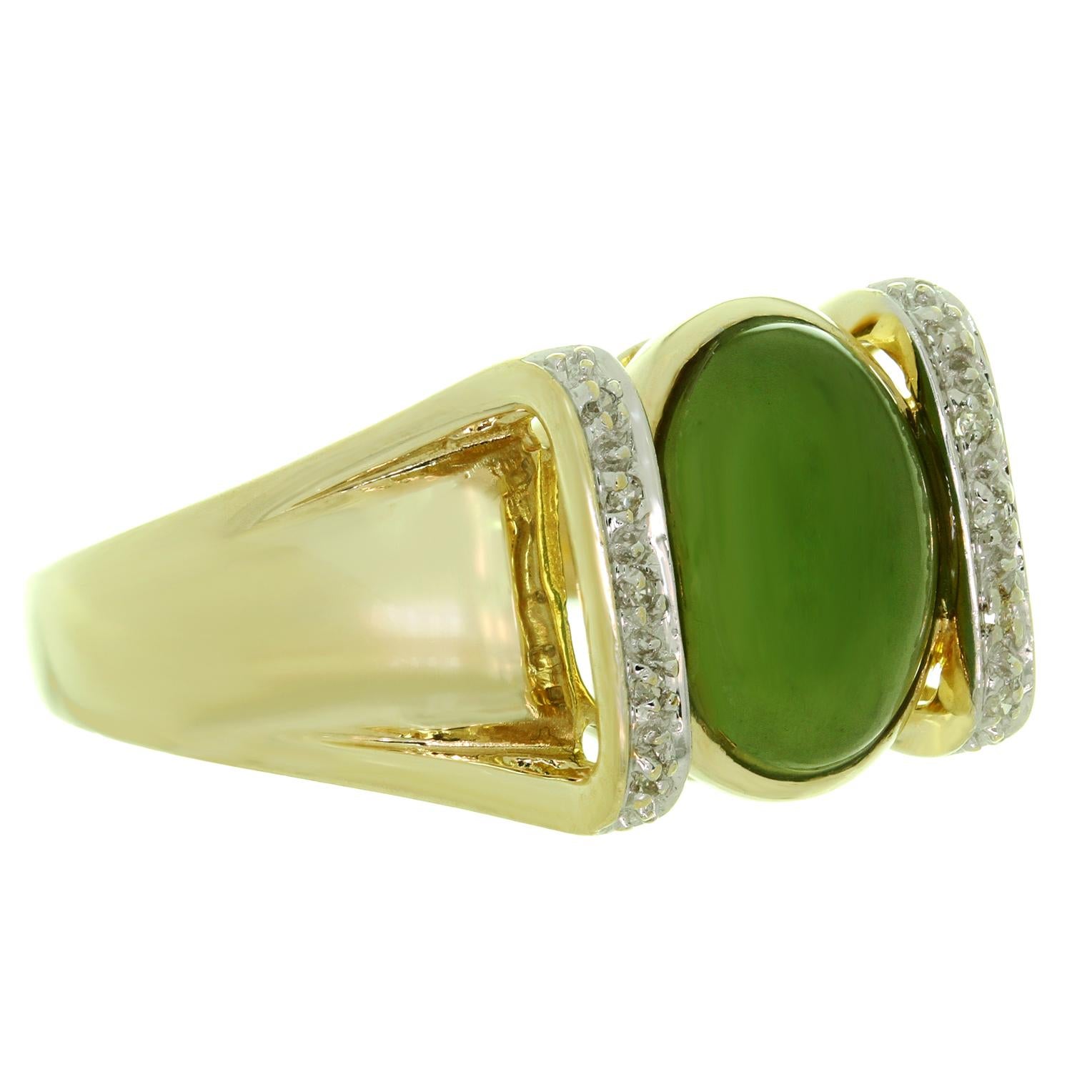 This classic estate collection cocktail ring is craftd in 14k yellow gold set with a green oval jade and surrounded with 10 single-cut round SI1-SI2 diamonds of an estimated 0.10 carats. Made in United States circa 1960s. Ring Size is 8 - EU 57.