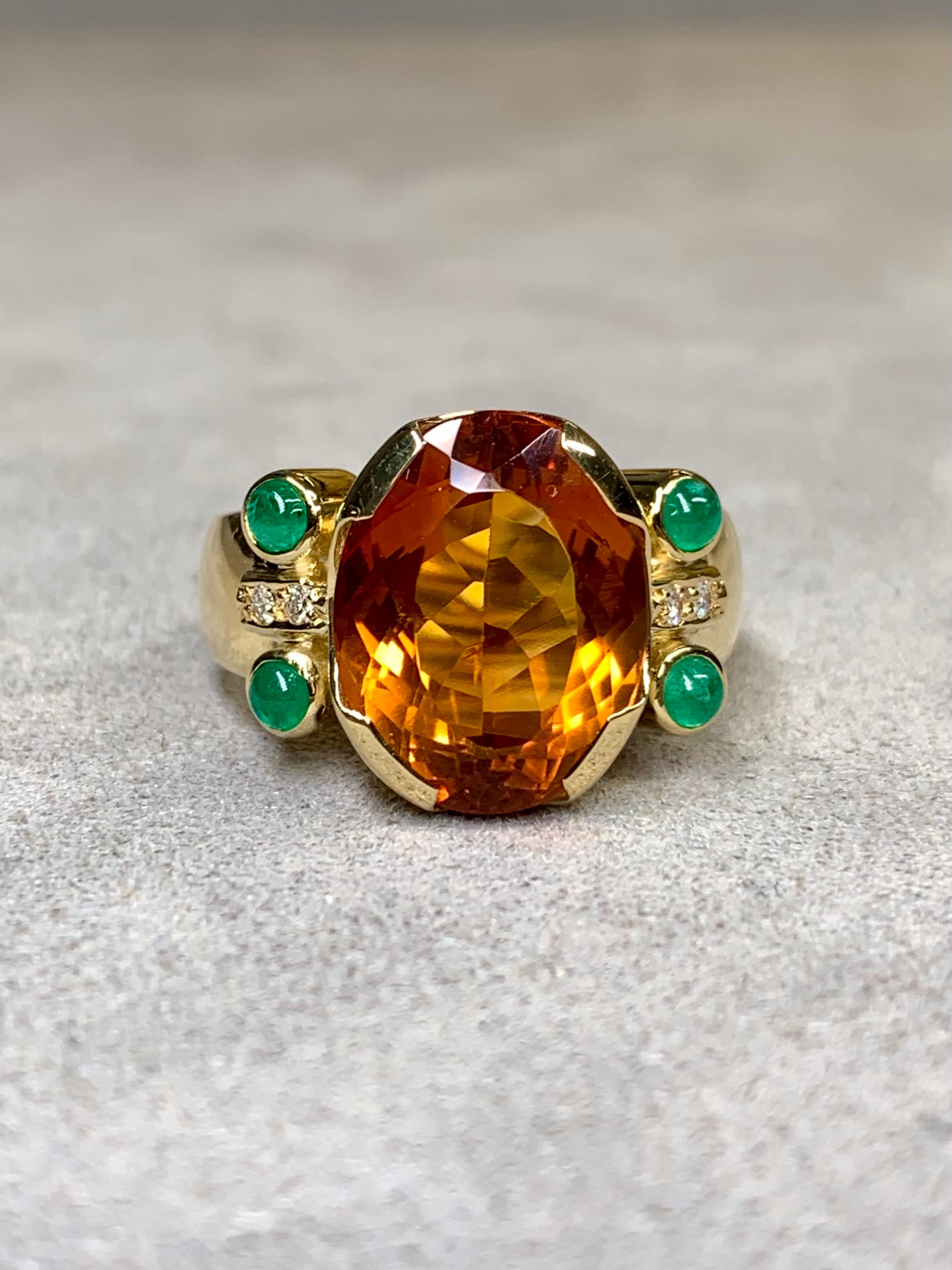 
A classic cocktail ring by famous Brazilian designer, H. Stern. It is handcrafted in 18K yellow gold and centered by an approximately 6.60ct natural Madeira citrine flanked by natural cabochon emeralds and round white VS