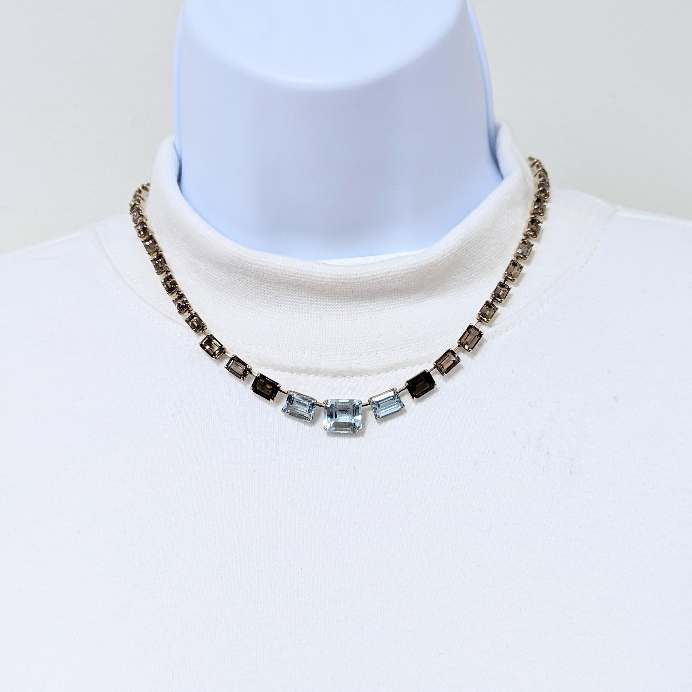 Beautiful necklace by H. Stern with big blue topaz and smokey topaz emerald cuts.  Handmade in 18k white gold.  Length is 17.25