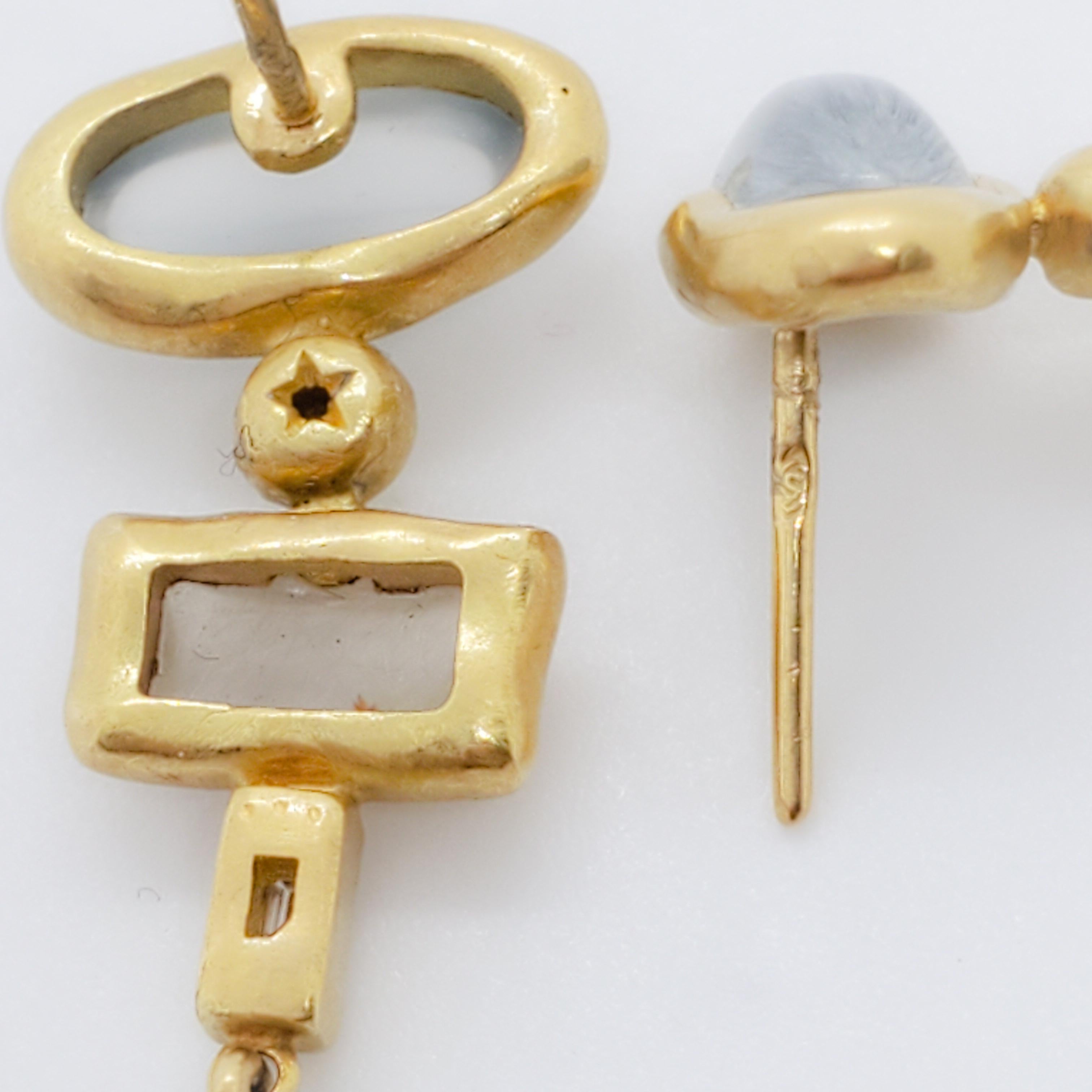 Beautiful H. Stern dangle earrings featuring green stones.  Handmade in 18k yellow gold.