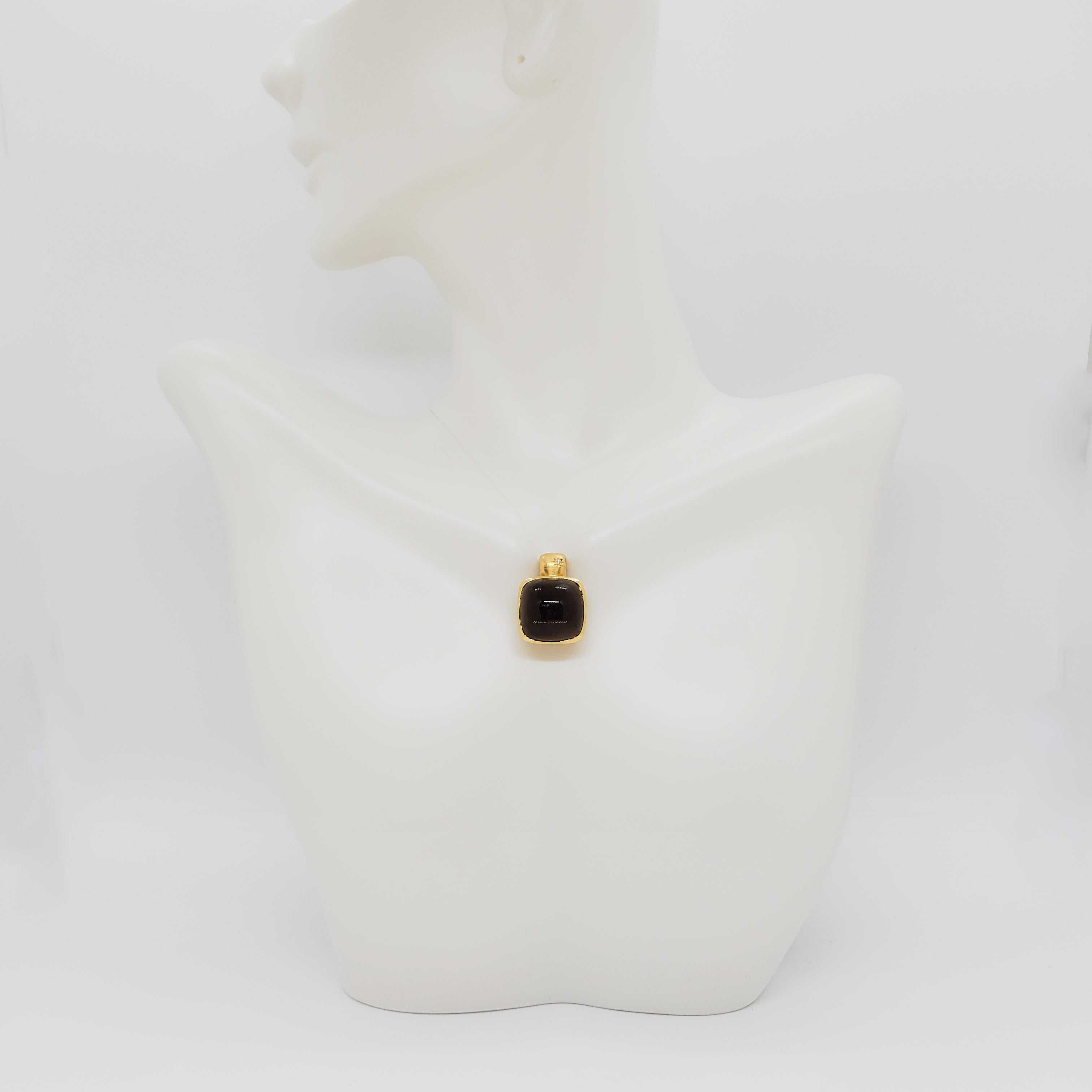 Beautiful pendant showcasing 5.00 ct. smoky quartz square cabochon with 0.01 ct. white diamond round.  Handmade 18k yellow gold mounting.  18